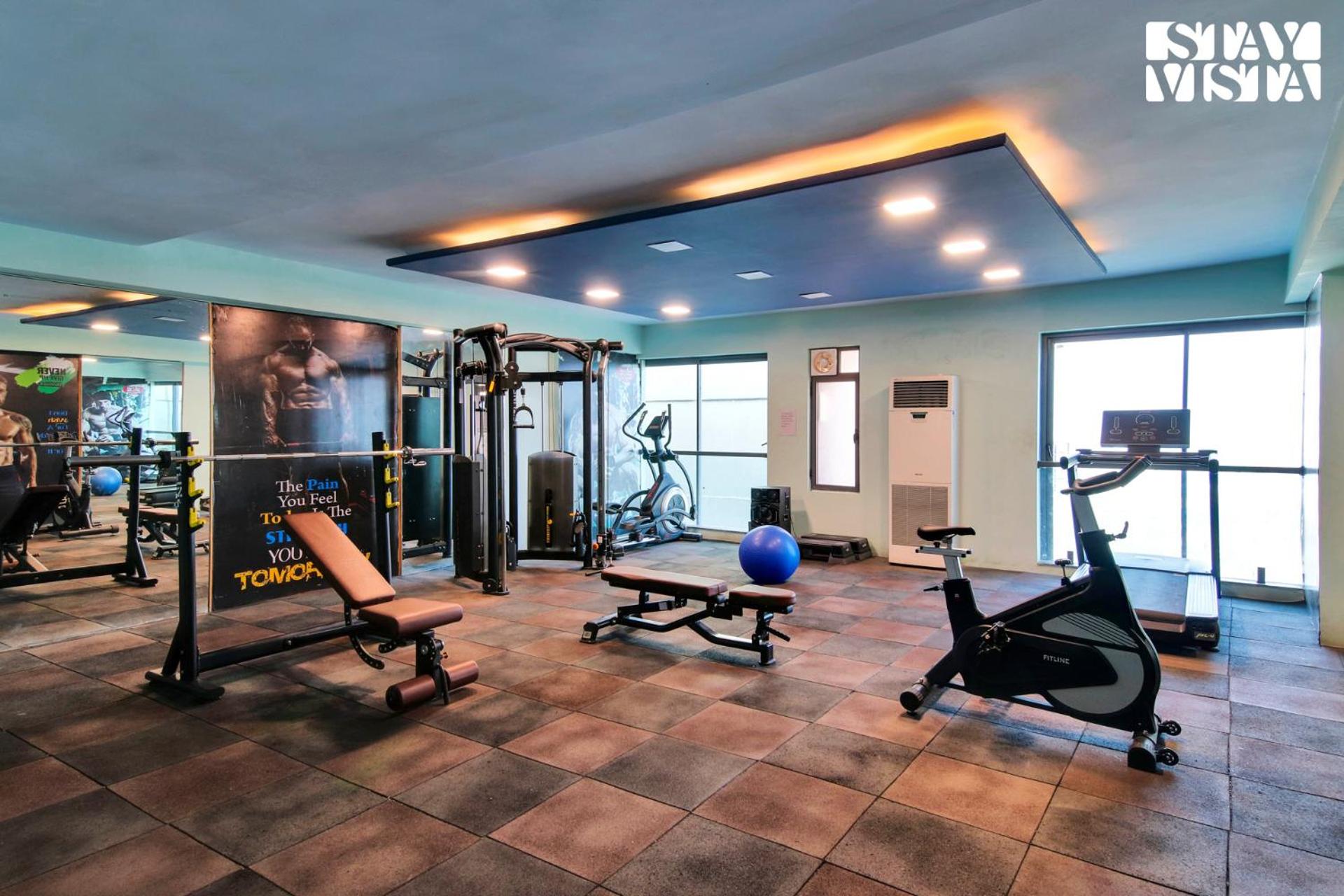 StayVista's Skyline Studio Apartments - Urban Oasis with Terrace, Gym & Bar