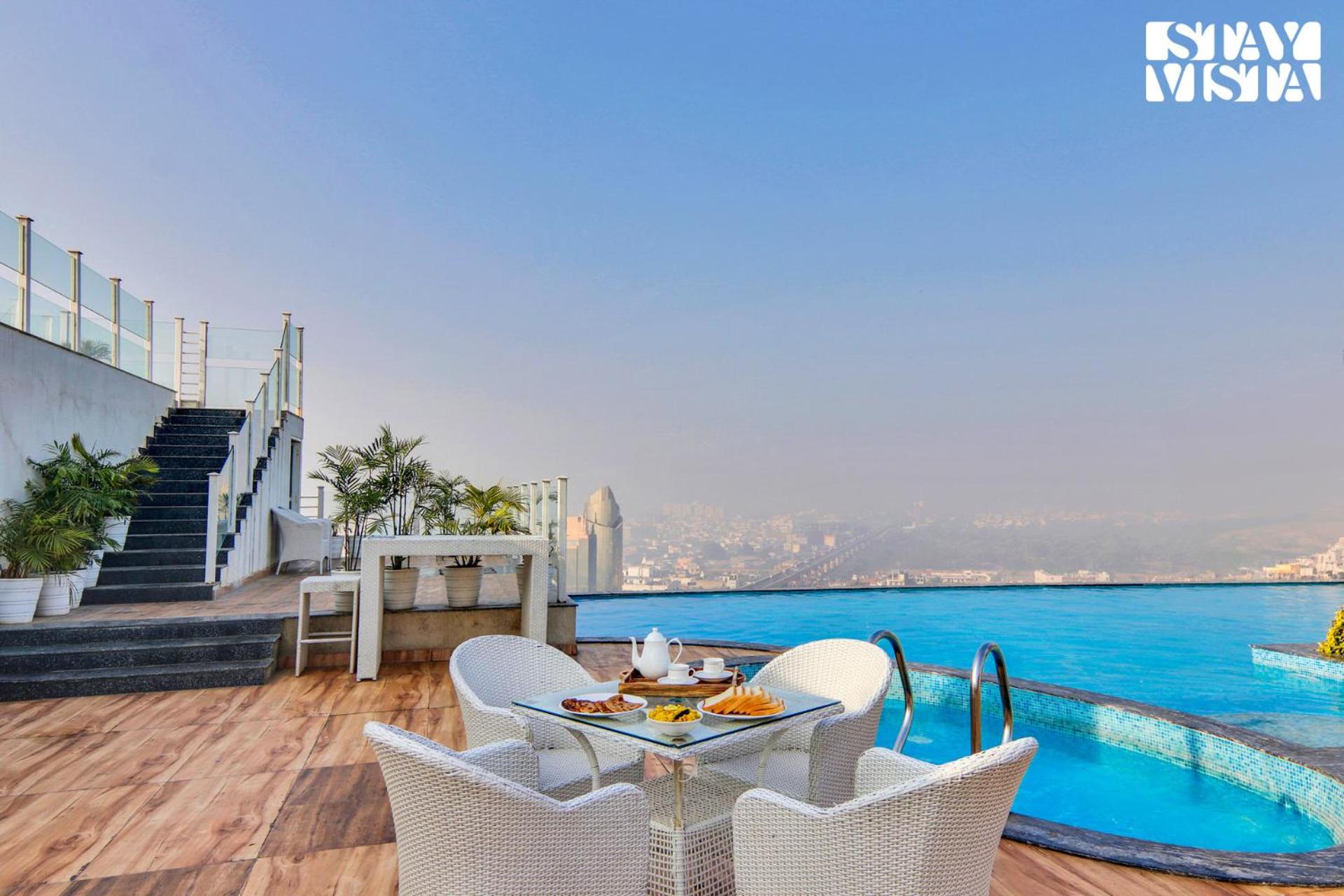StayVista's Skyline Studio Apartments - Urban Oasis with Terrace, Gym & Bar