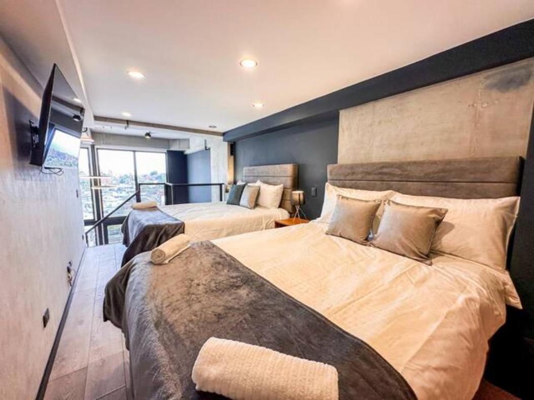 Skyline Suites - Elegant Living with Coworking & Scenic Views