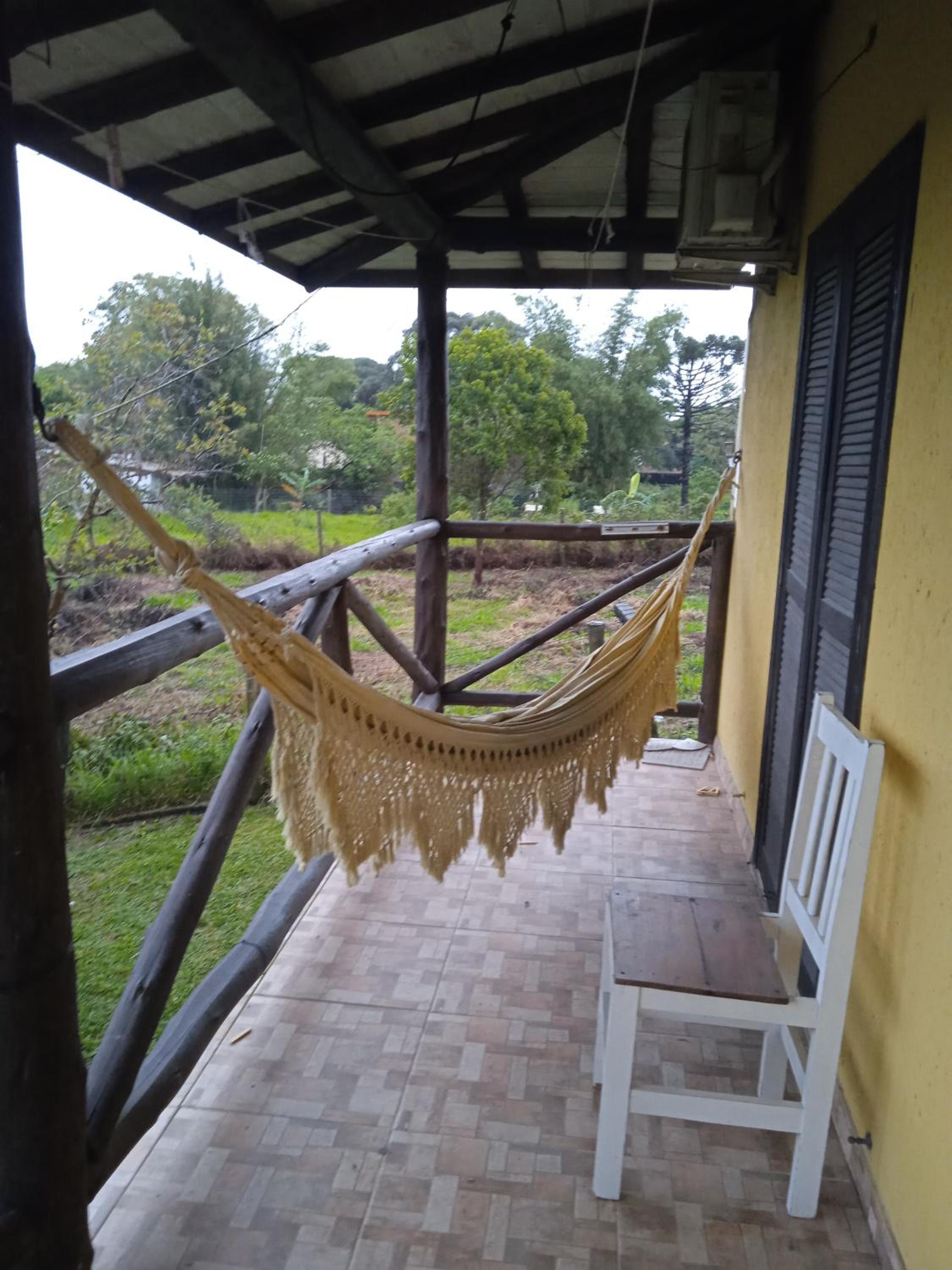 Casa amarela no Rosa