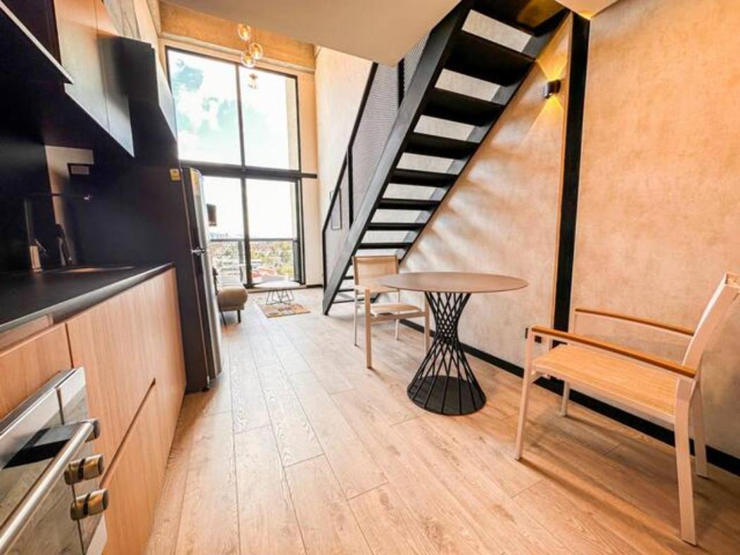 Skyline Suites - Elegant Living with Coworking & Scenic Views