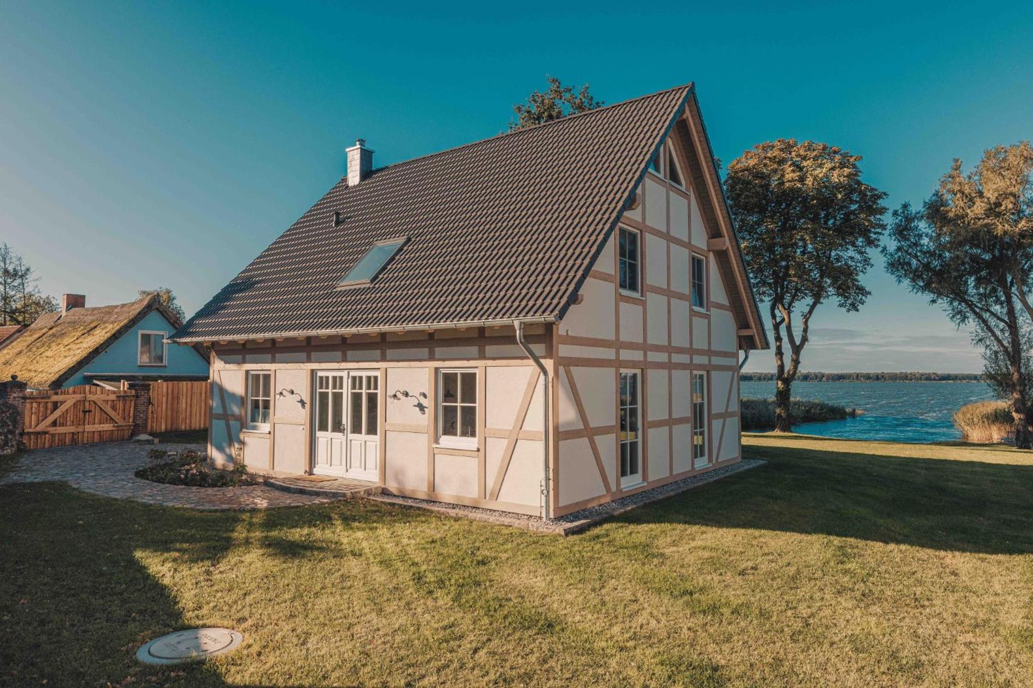Watermark Usedom - Premium Ferienhaus direkt am Wasser mit eigener Badestelle - Haus Welle