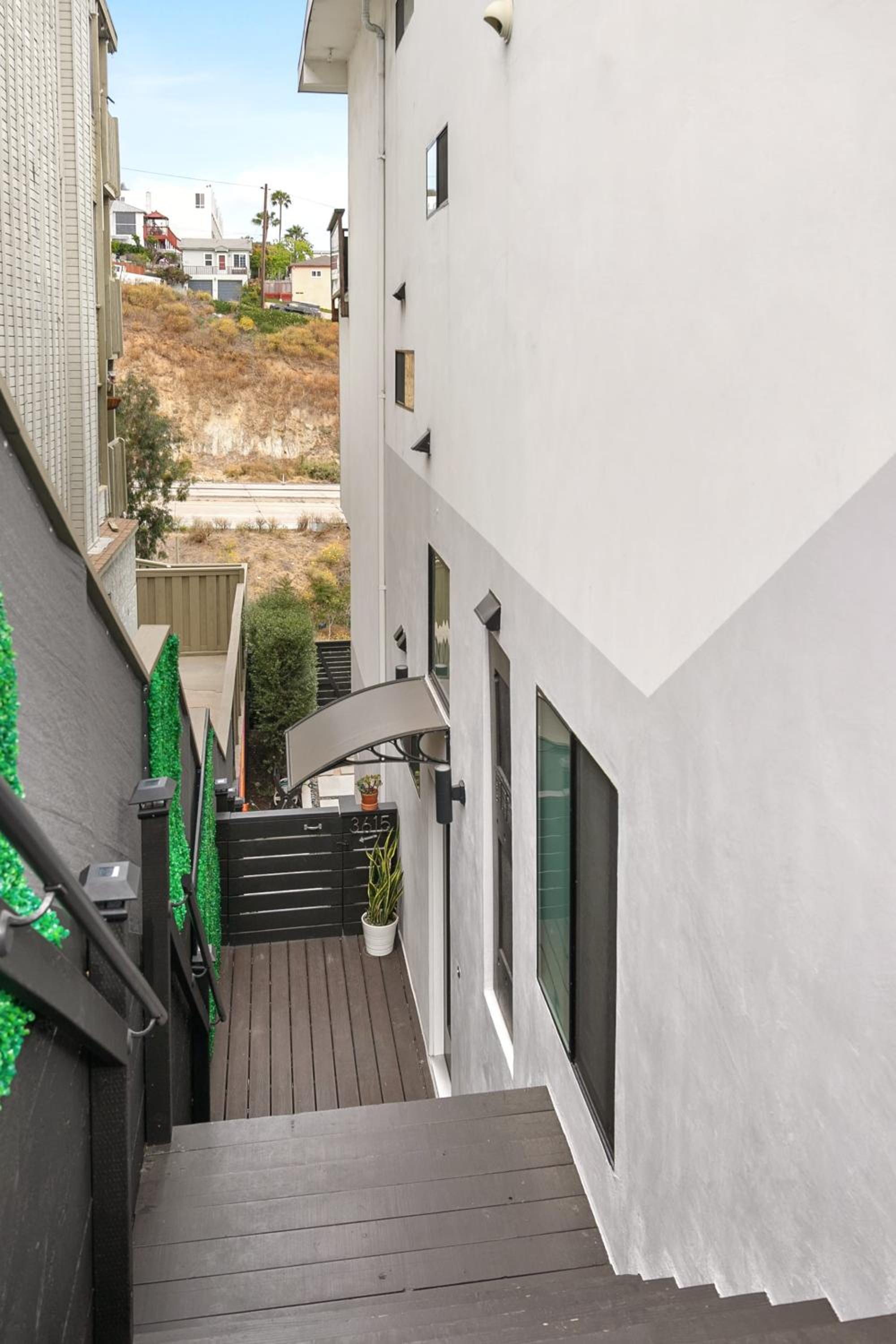 Vibrant Hillside Retreat with Harbor Views King bed view 5