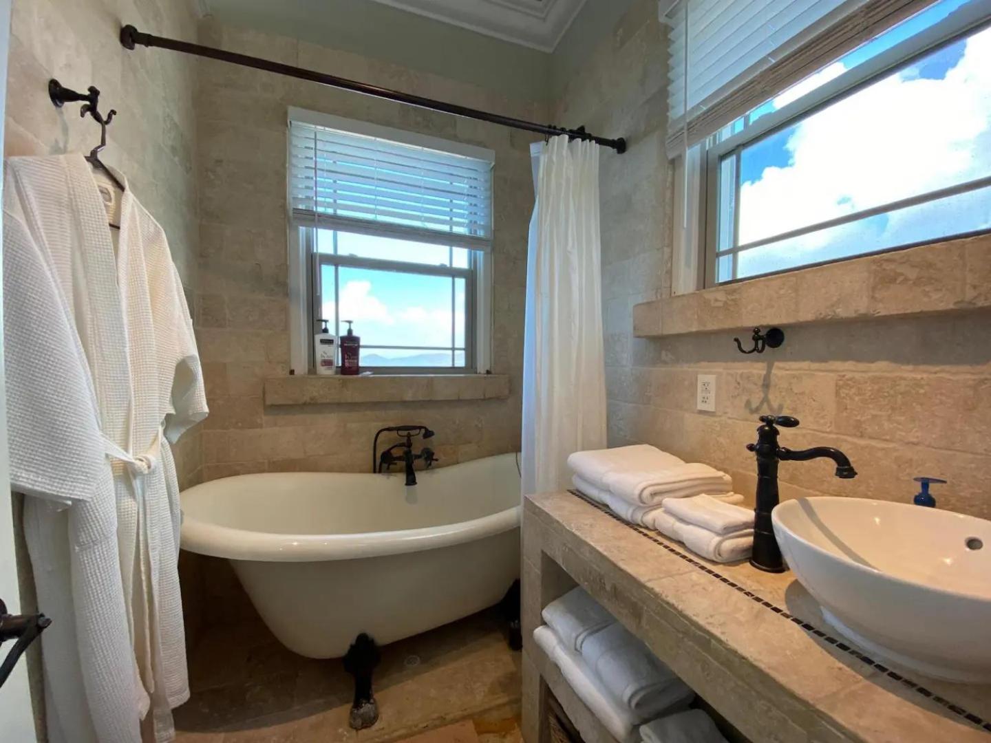 Honeymoon Cottage Atop a rocky peninsula surrounded by the Caribbean Sea view 3