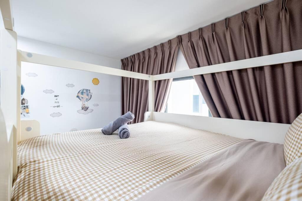 M Vertica Tower B by Feel Home
