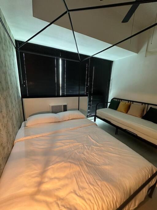 1br wNetflix Disneyplus and pool across SM Megamall Ortigas CBD view 2