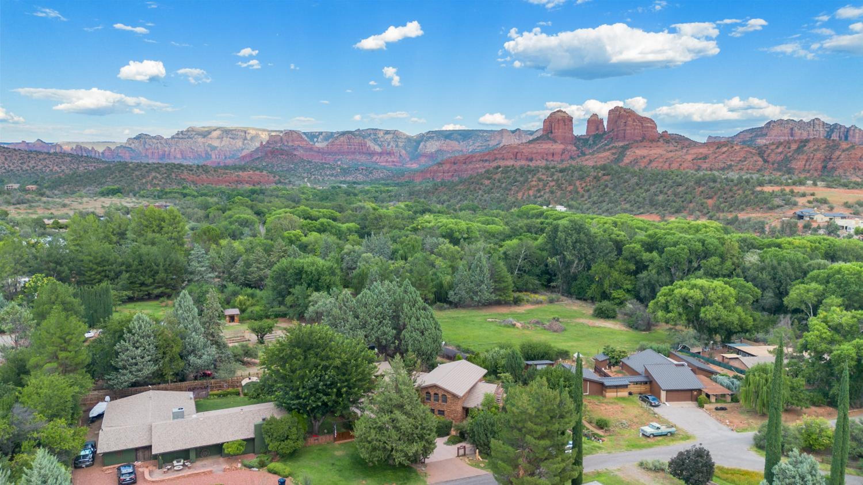 Beautiful Upscale Home with Views of Cathedral Rock, a Stream, Lush Fruit Trees view 3