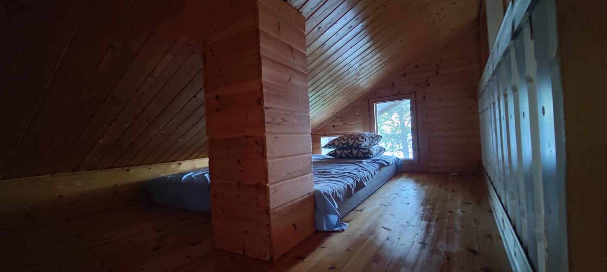 Traditional Finnish lakeside off-grid cabin