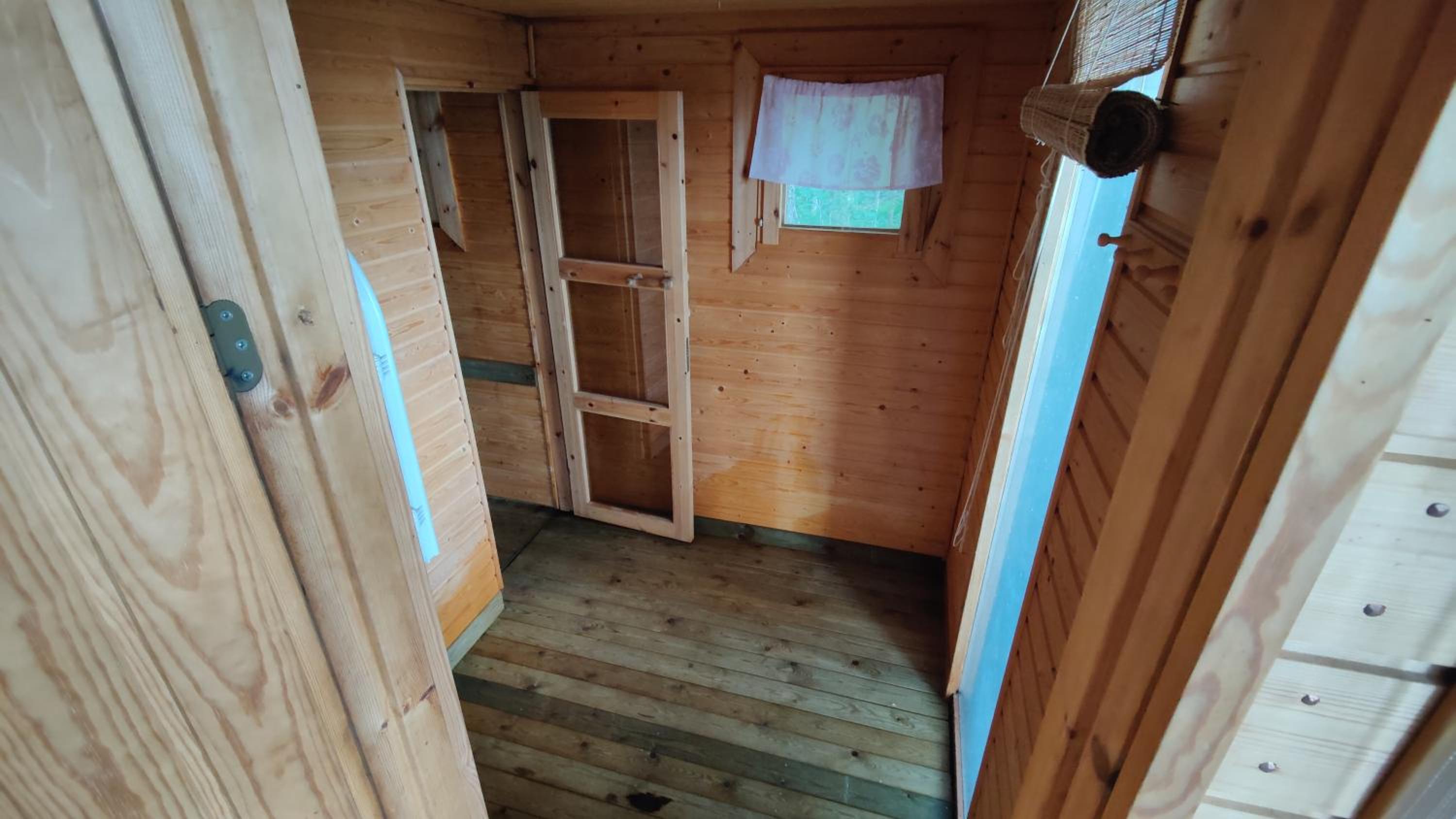 Traditional Finnish lakeside off-grid cabin