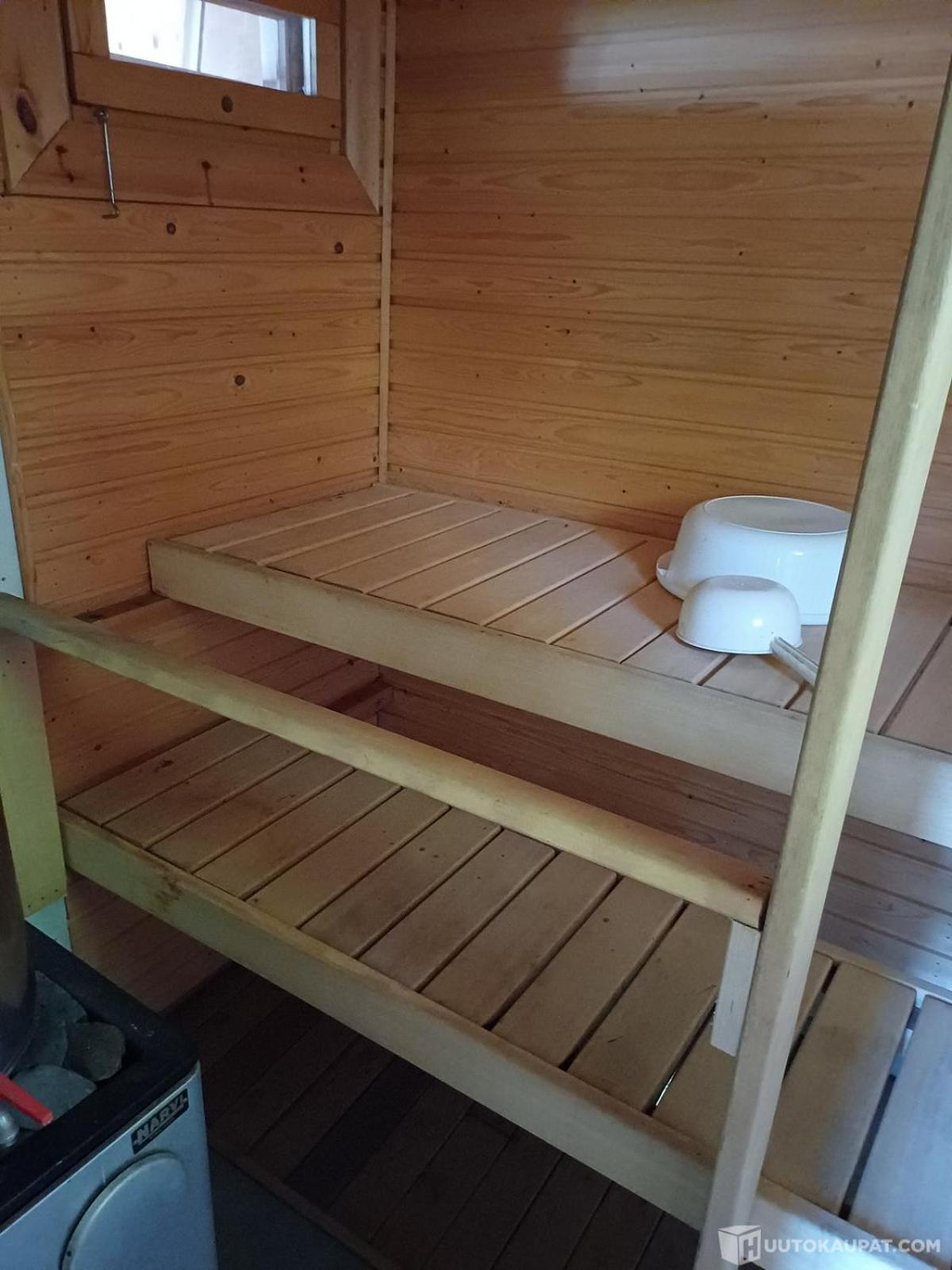 Traditional Finnish lakeside off-grid cabin