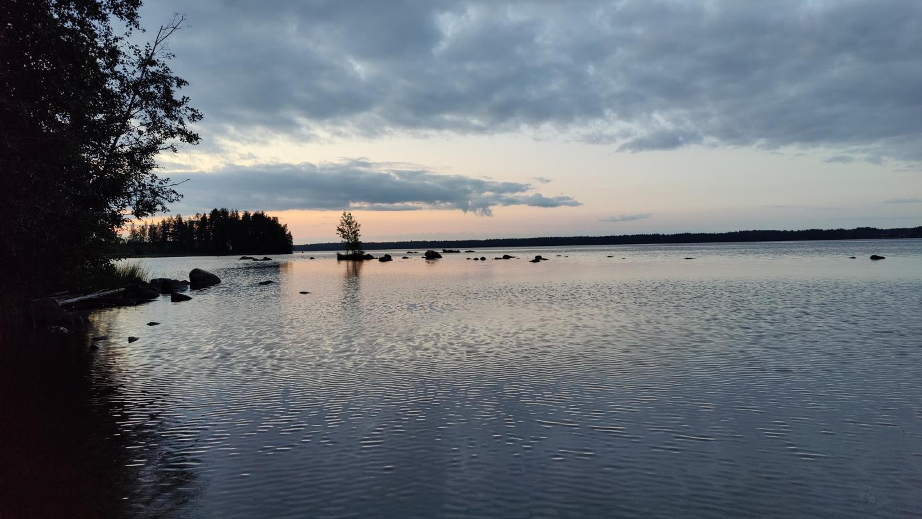 Traditional Finnish lakeside off-grid cabin