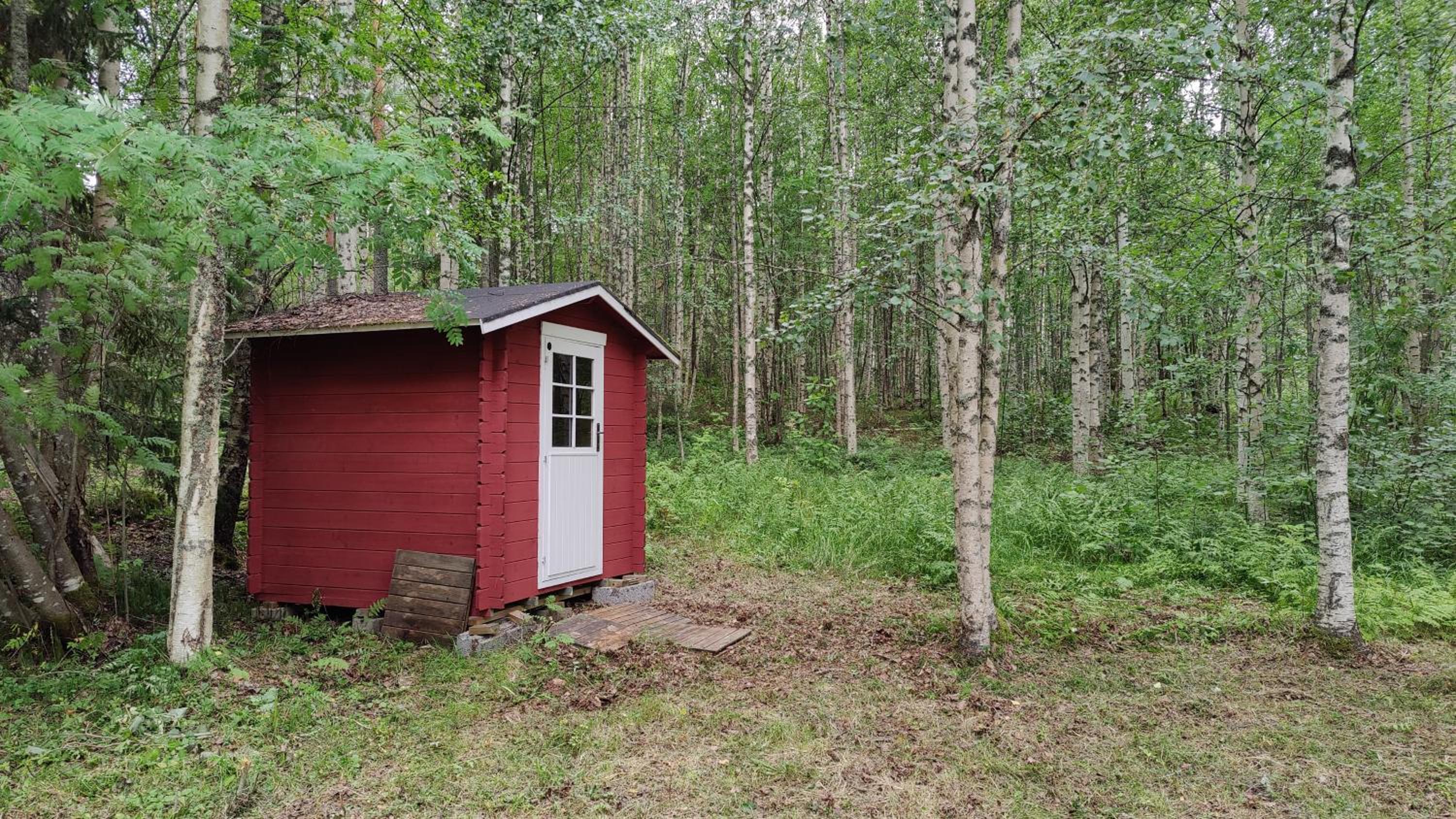 Traditional Finnish lakeside off-grid cabin
