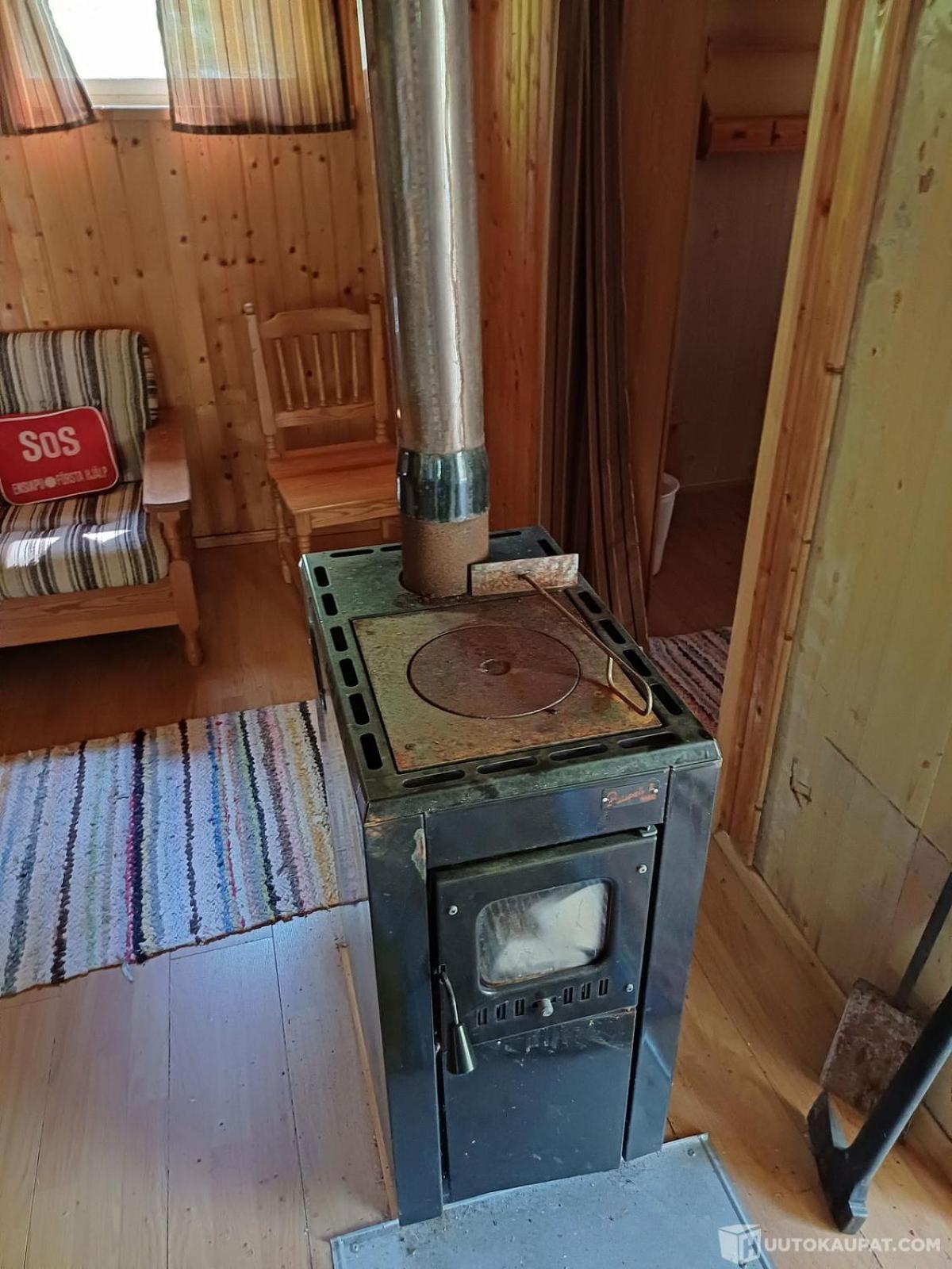 Traditional Finnish lakeside off-grid cabin