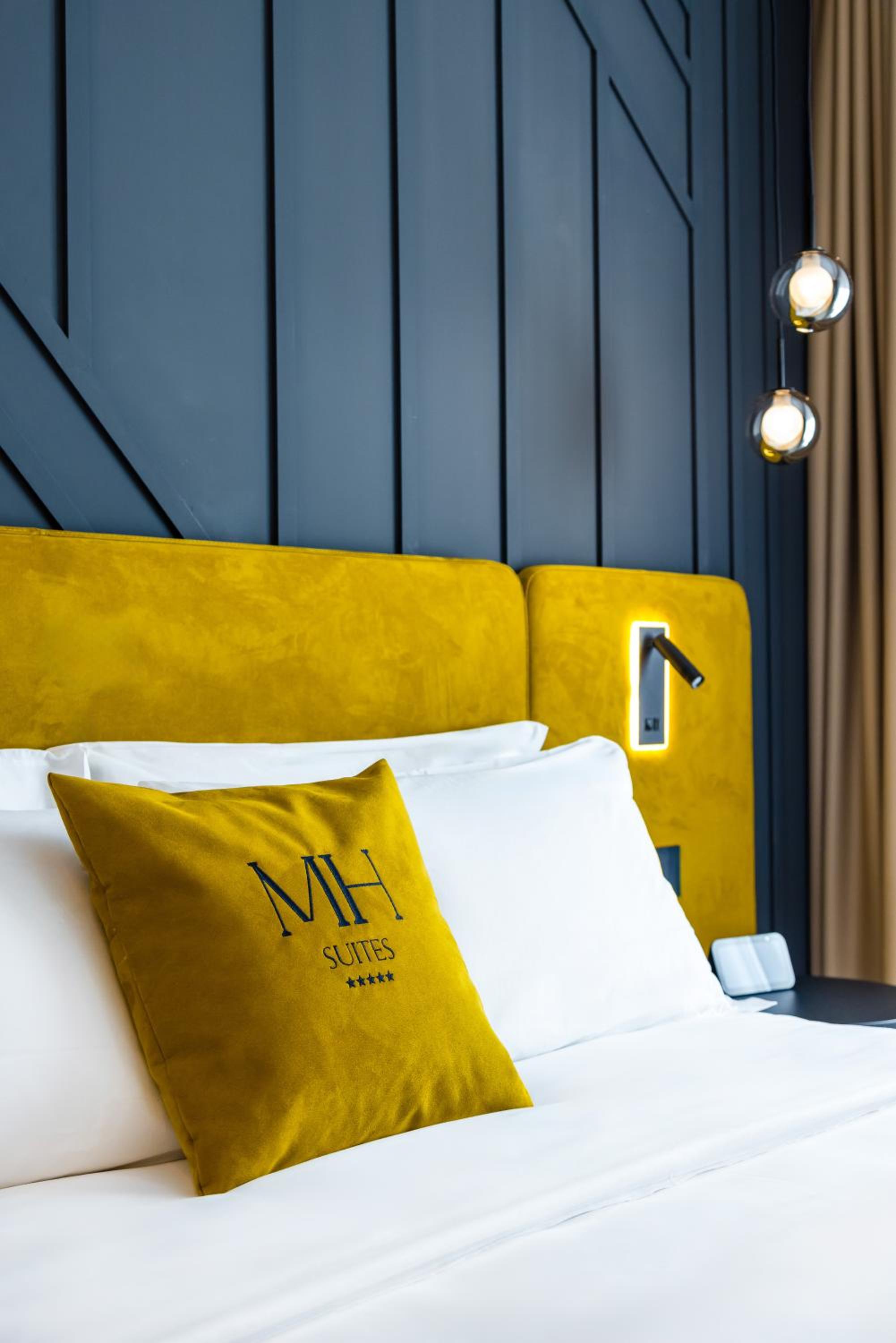 MH SUITES Plebiscito
