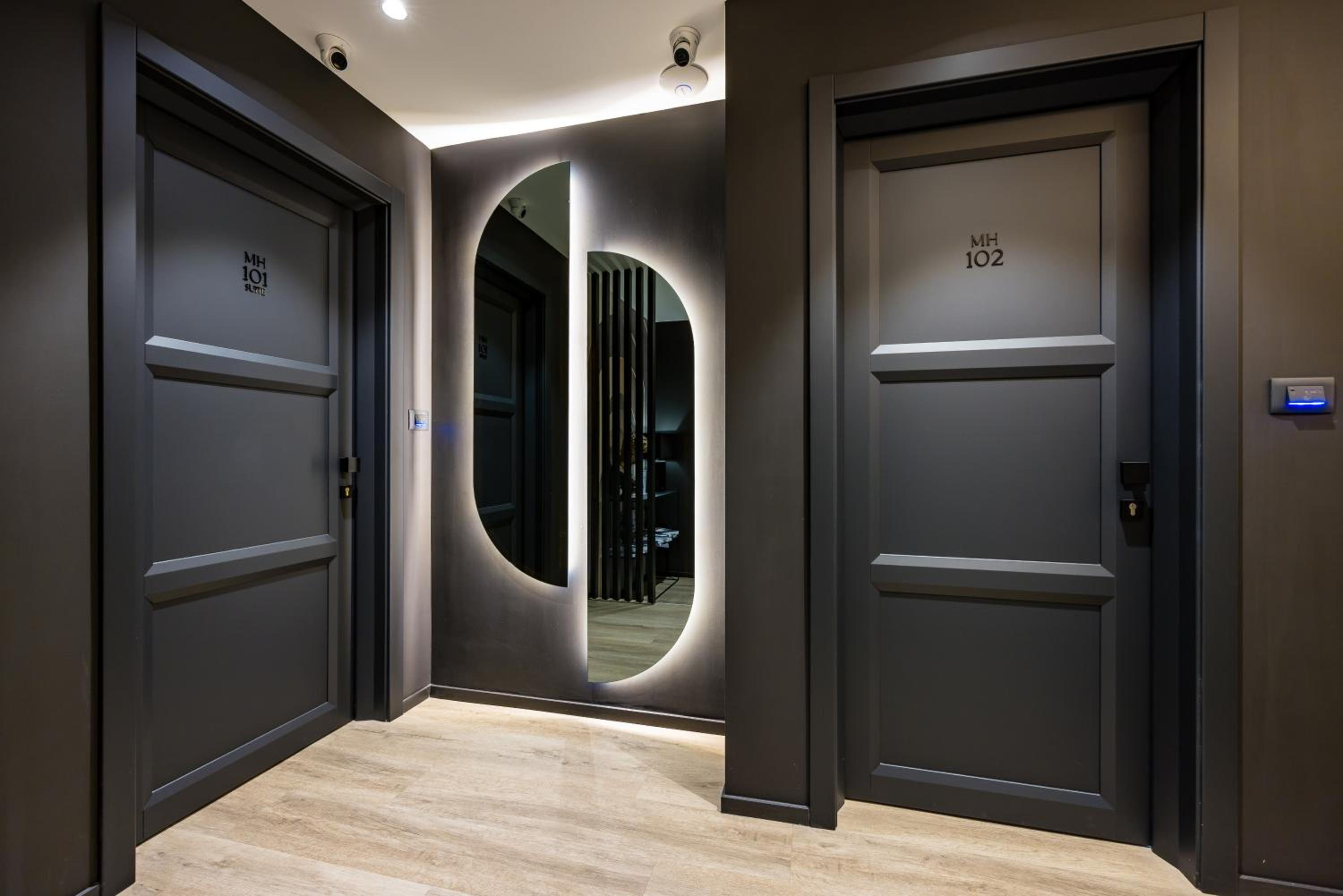 MH SUITES Plebiscito