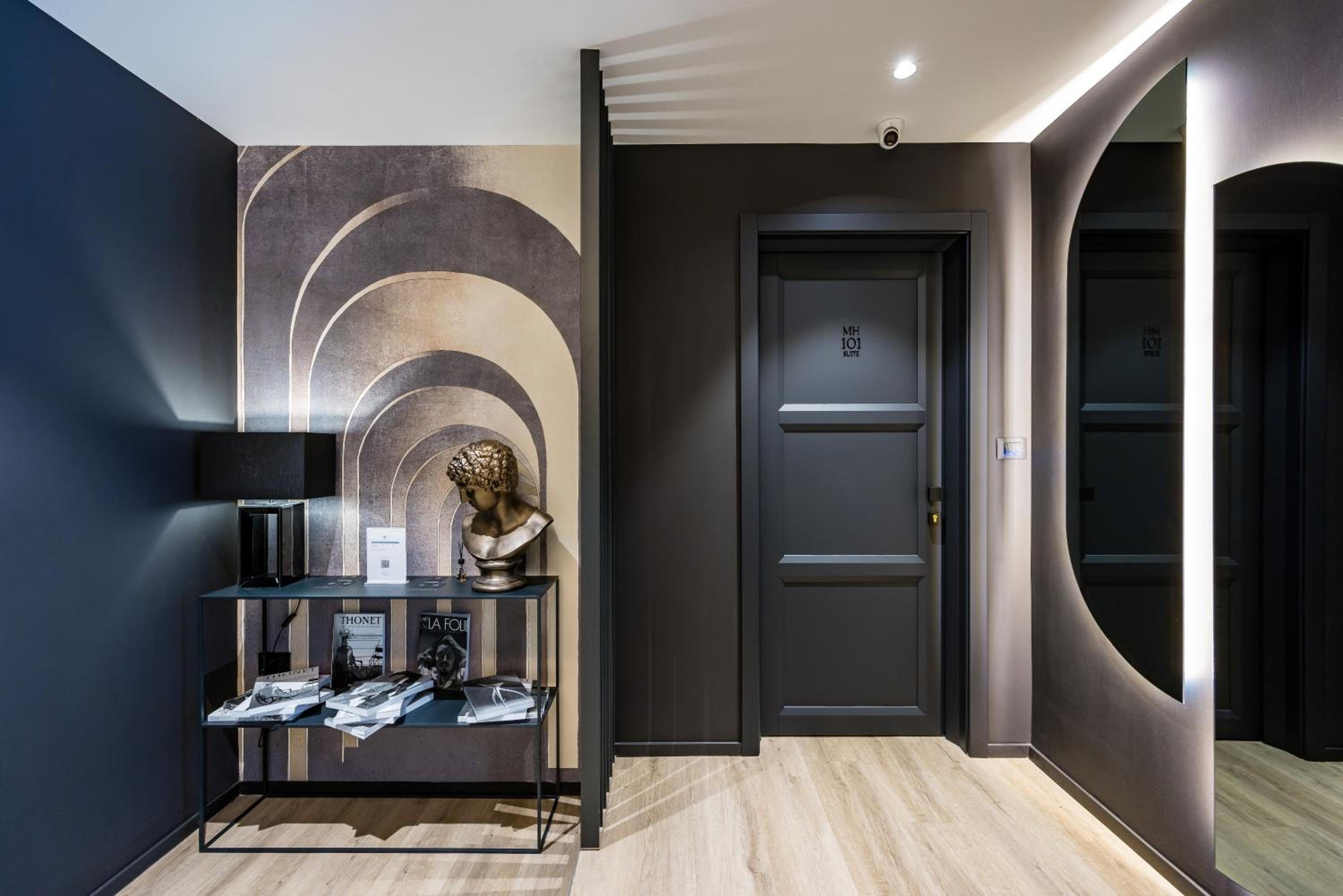 MH SUITES Plebiscito