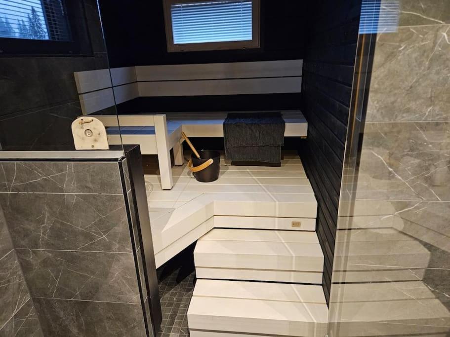 Modern log house with jacuzzi and sauna