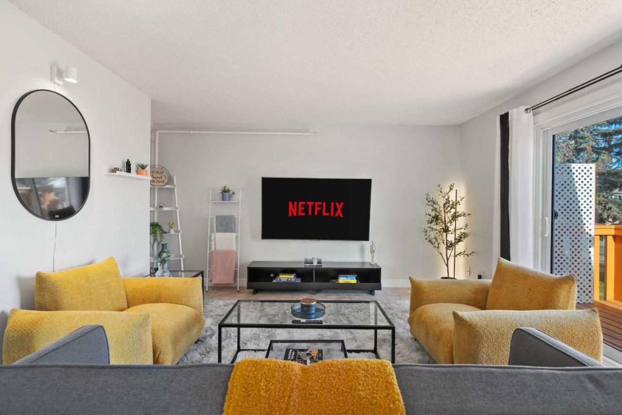 Spacious 4-Bedroom Retreat Near Bow River with Foosball, Dart Board, Movie Room
