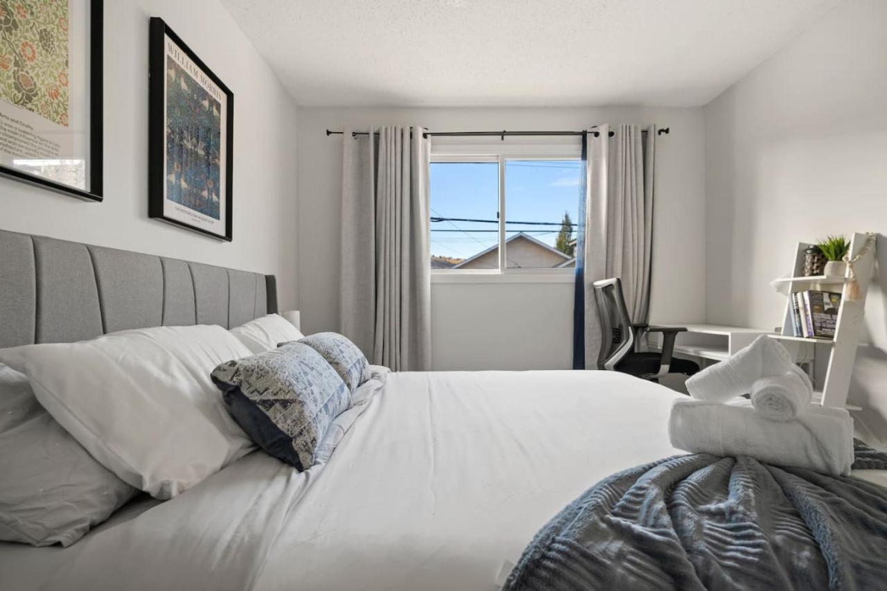 Spacious 4-Bedroom Retreat Near Bow River with Foosball, Dart Board, Movie Room
