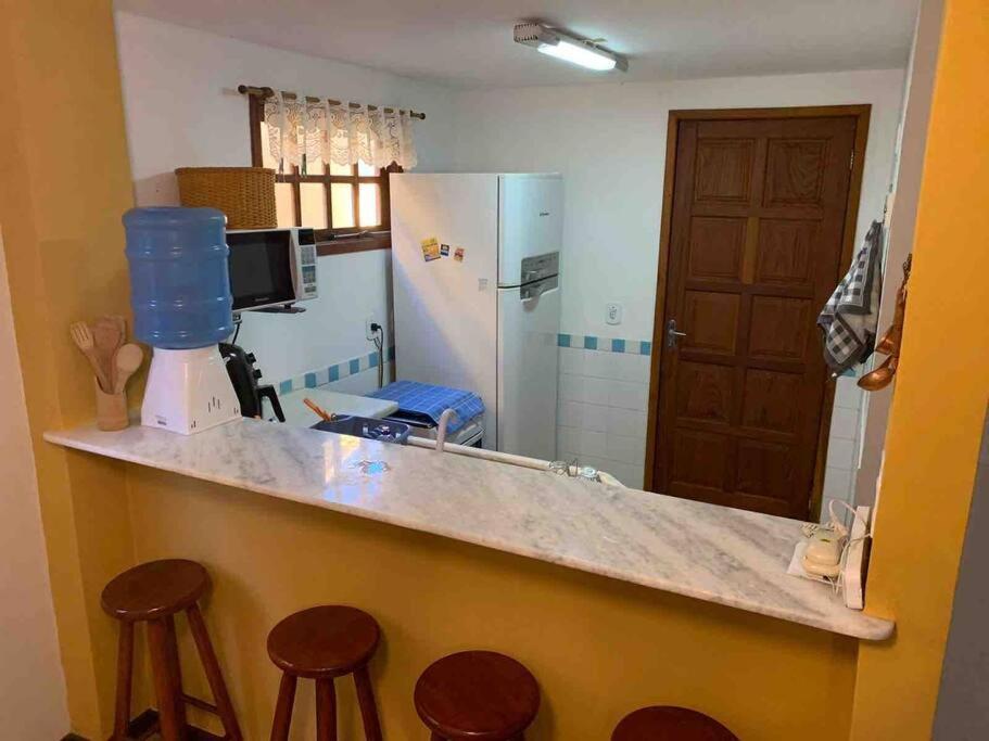 Casa em condomínio com lazer de frente para praia