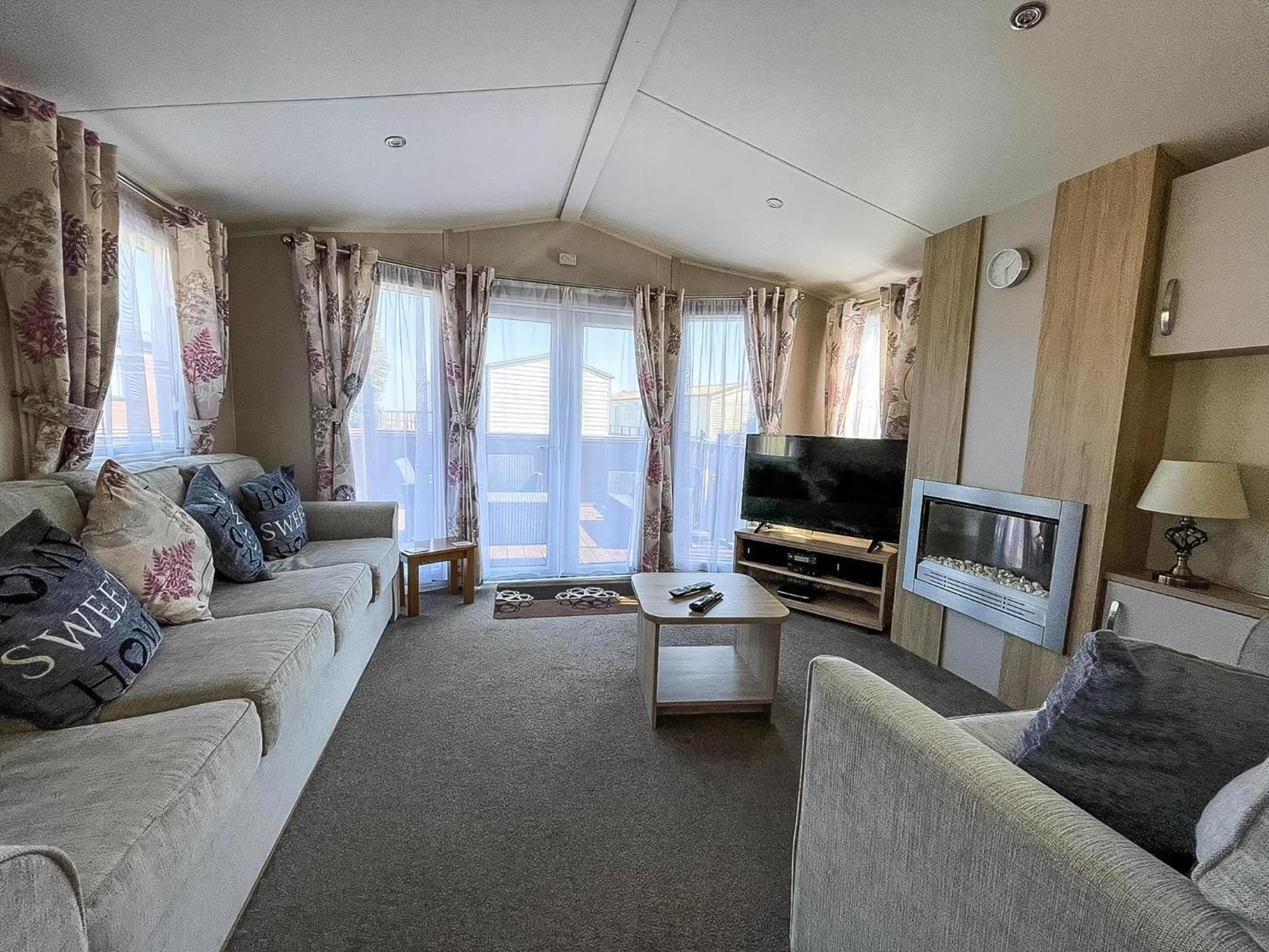 Modern Caravan With Decking At Azure Seas Along The Suffolk Coast Ref 32065Az view 5