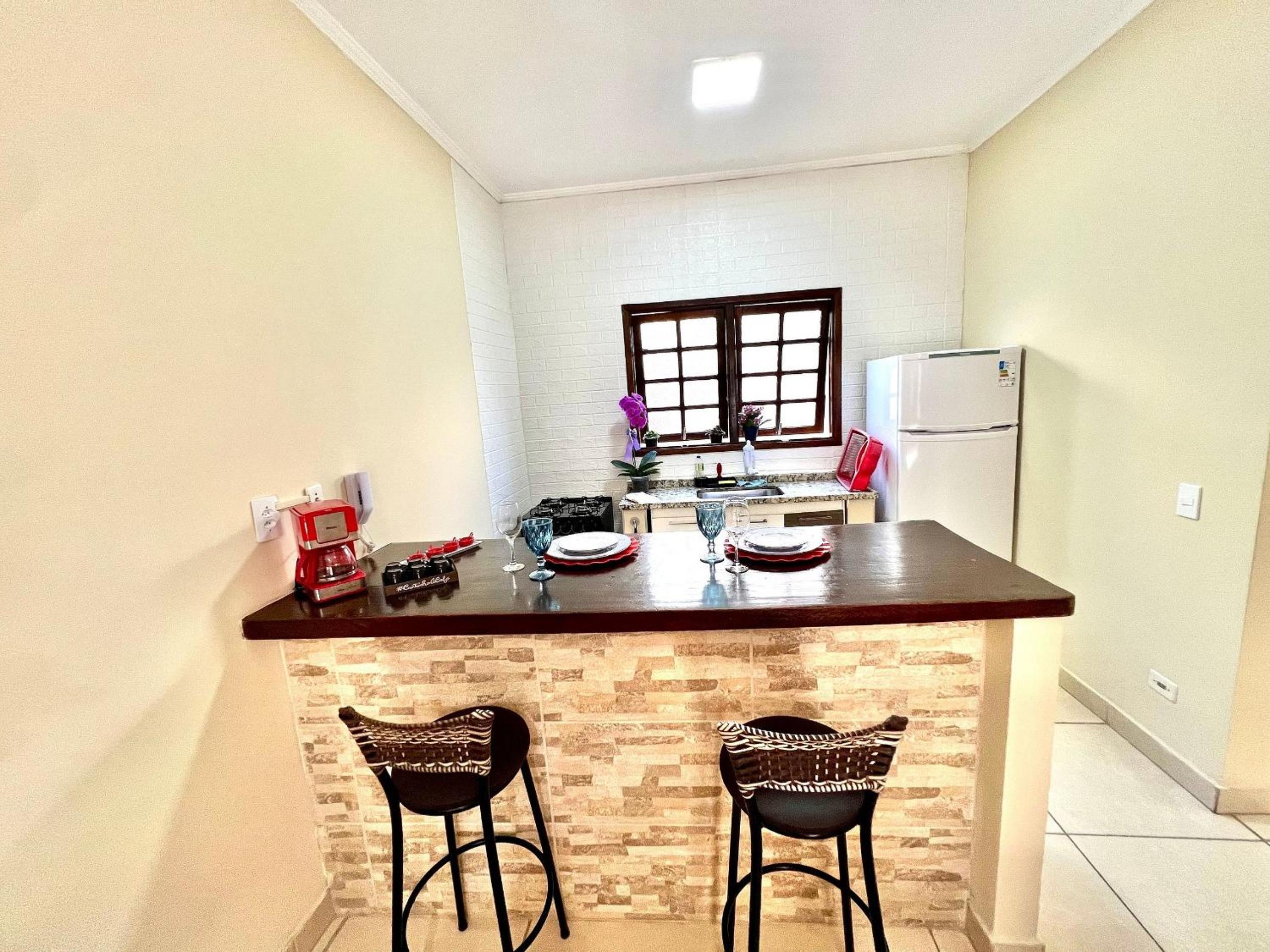 Studio pé na areia com área de churrasco privativa