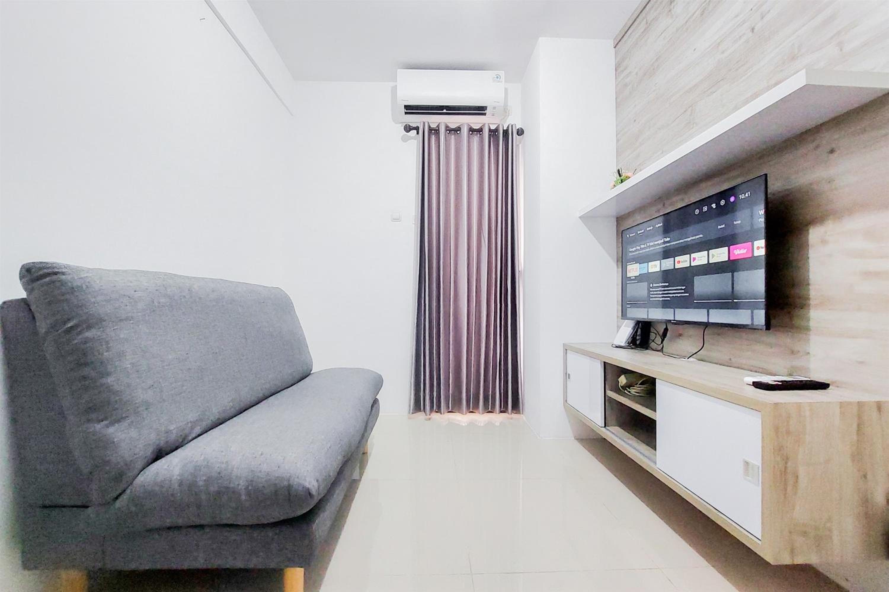 Homey and Comfort Living 2BR Urbantown Serpong Apartment By Travelio view 4