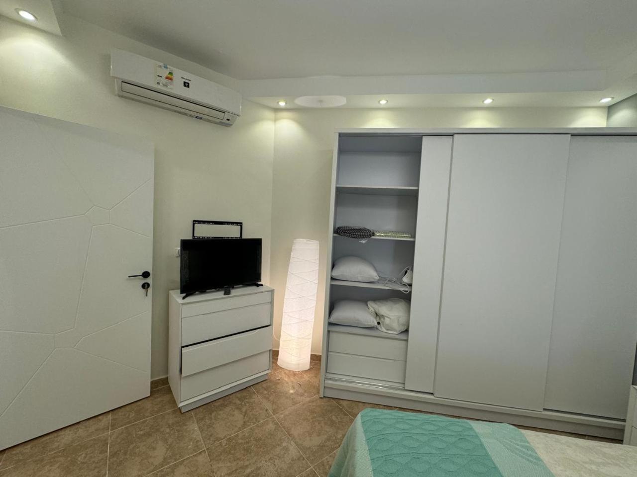 A one-bedroom apartment with a compact terrace