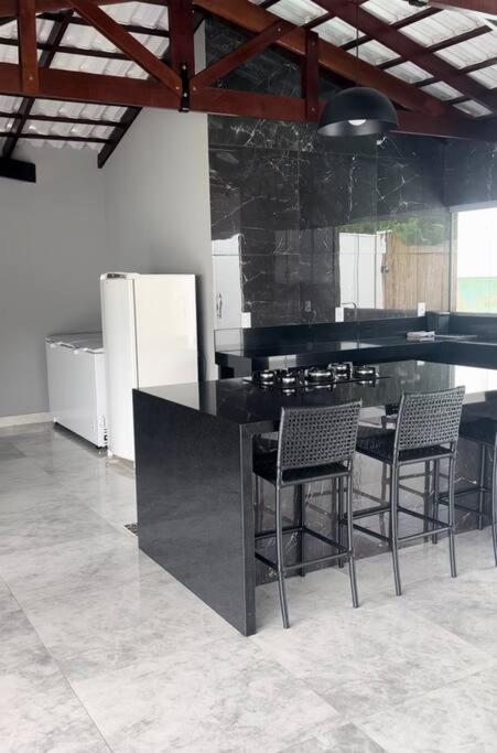 Casa com piscina em Florestal