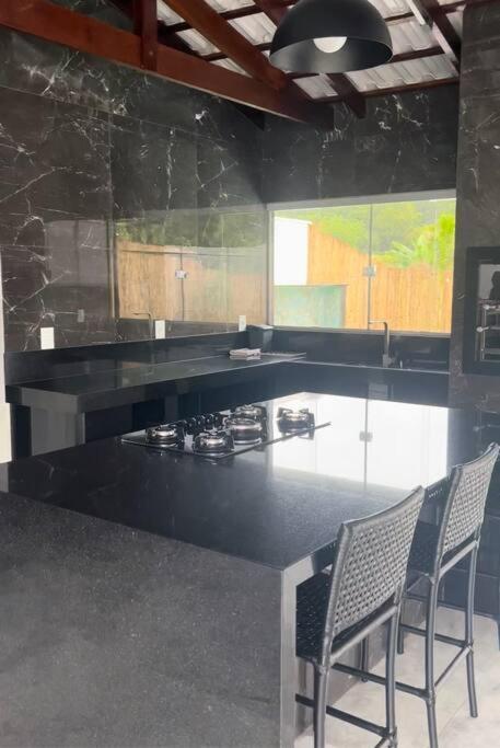 Casa com piscina em Florestal