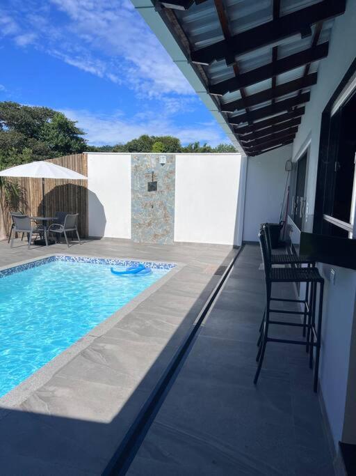 Casa com piscina em Florestal