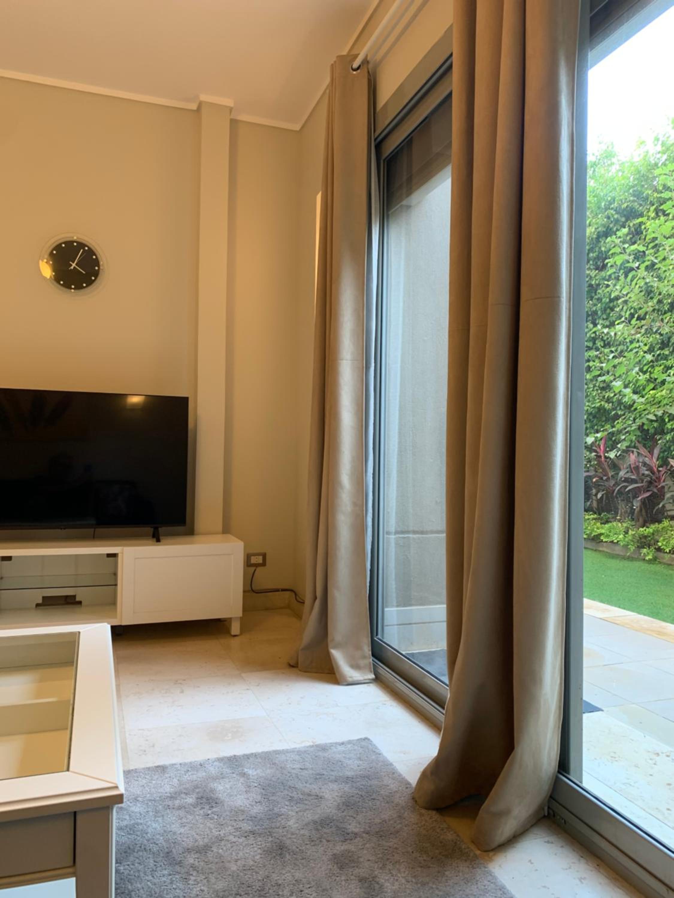 Private Garden 1BR Apt in Palm Hills AUC New Cairo