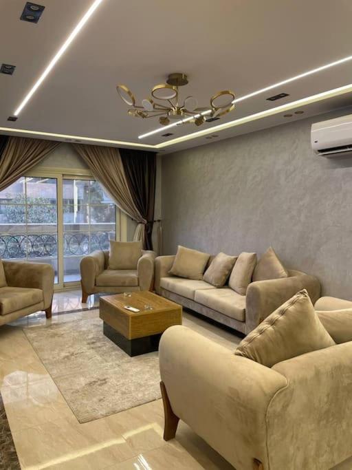 Stylish 3BR Apartment in Prime Mohandessin for families Y7