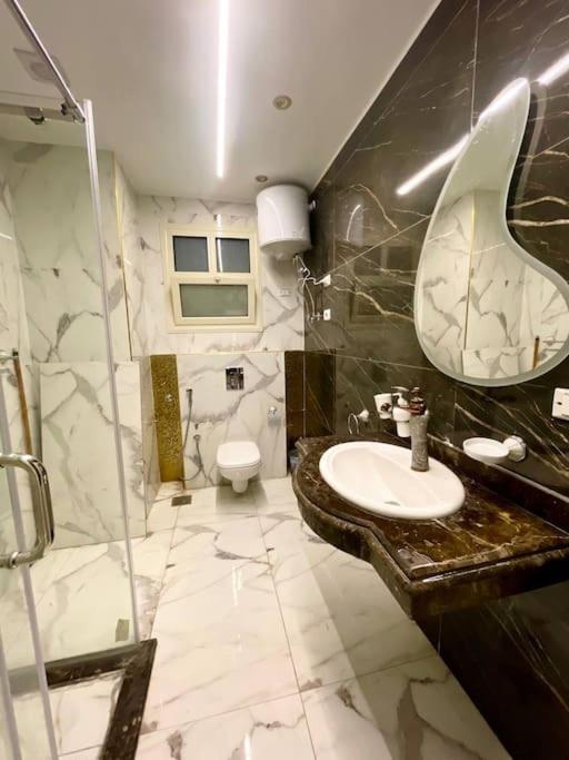 Stylish 3BR Apartment in Prime Mohandessin for families Y7