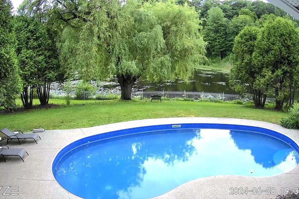 Waterfront heated pool seasonal Acre yard BBQ