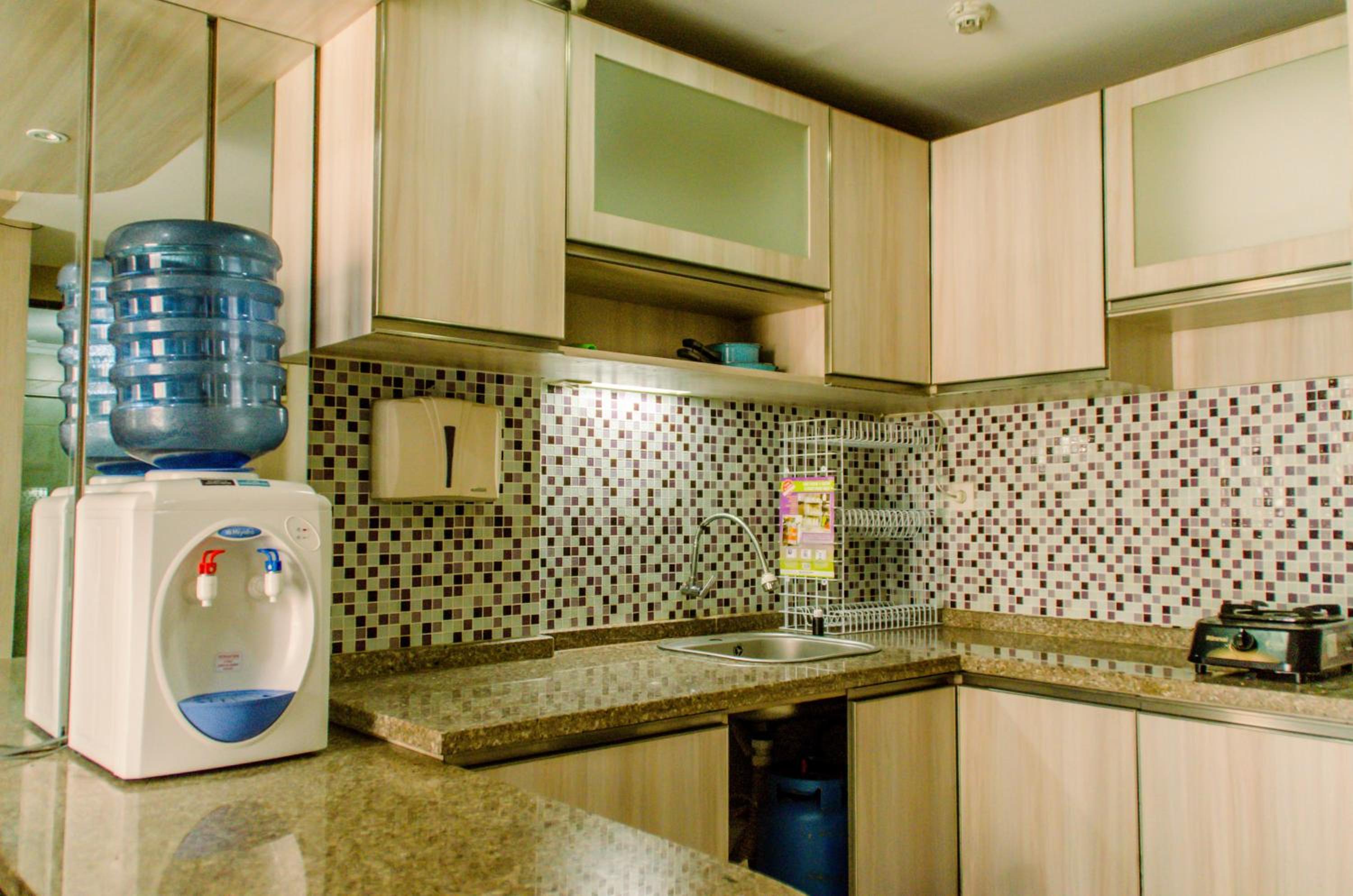 Simply and Cozy Pool View 2BR at Great Western Apartment By Travelio view 4