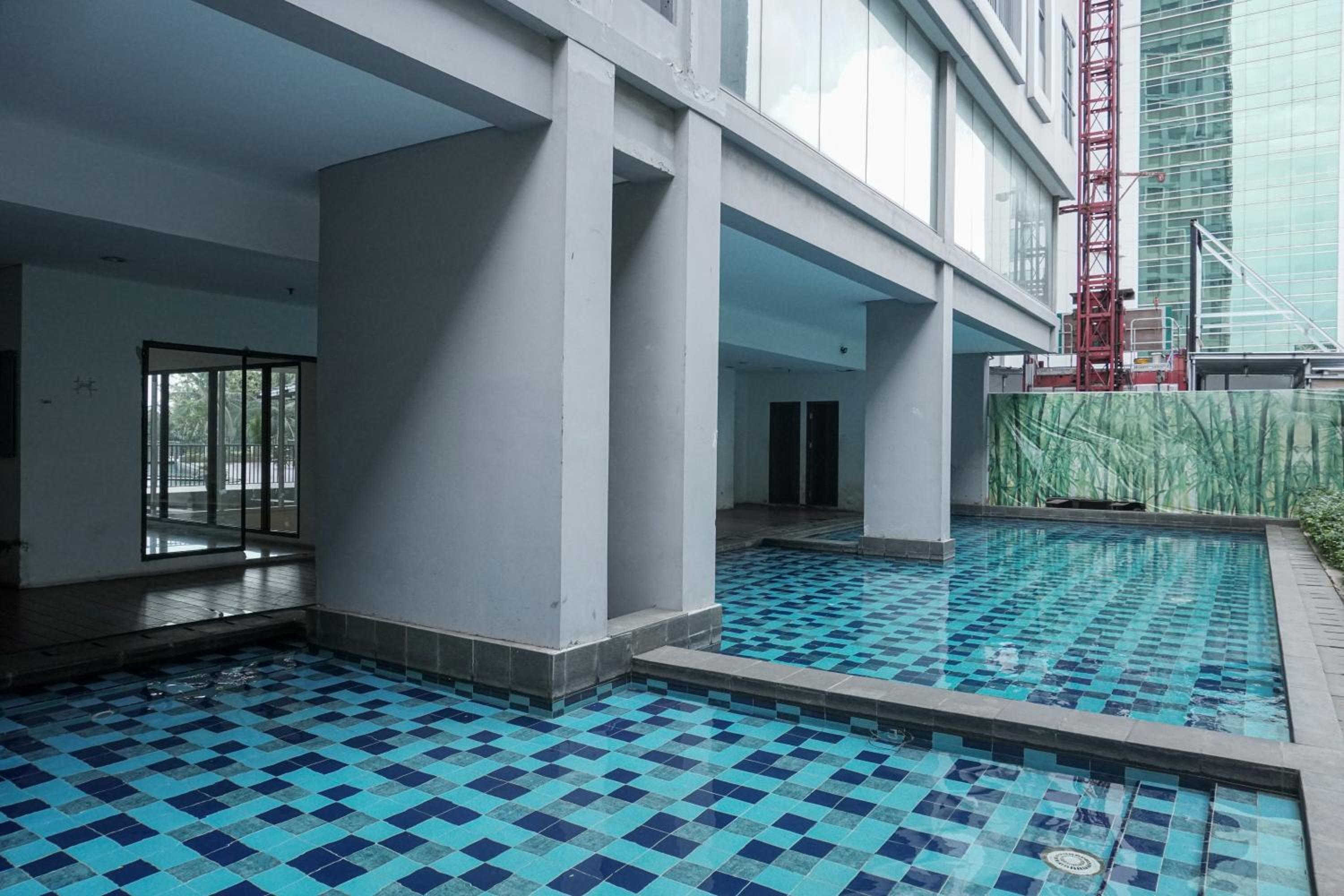 Attractive 1BR Apartment at Royal Olive Residence By Travelio view 5
