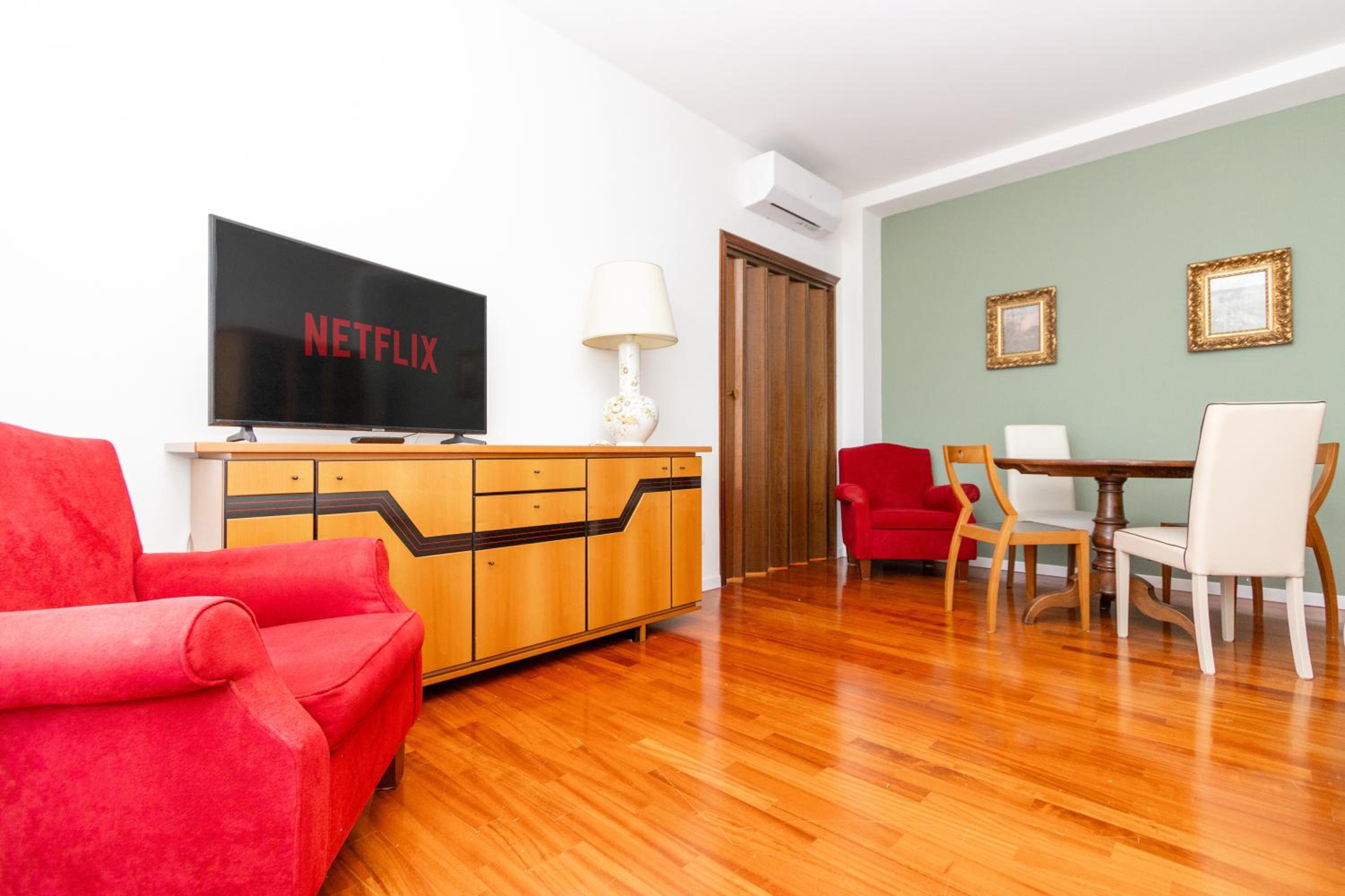 Modern suite with balcony and park view