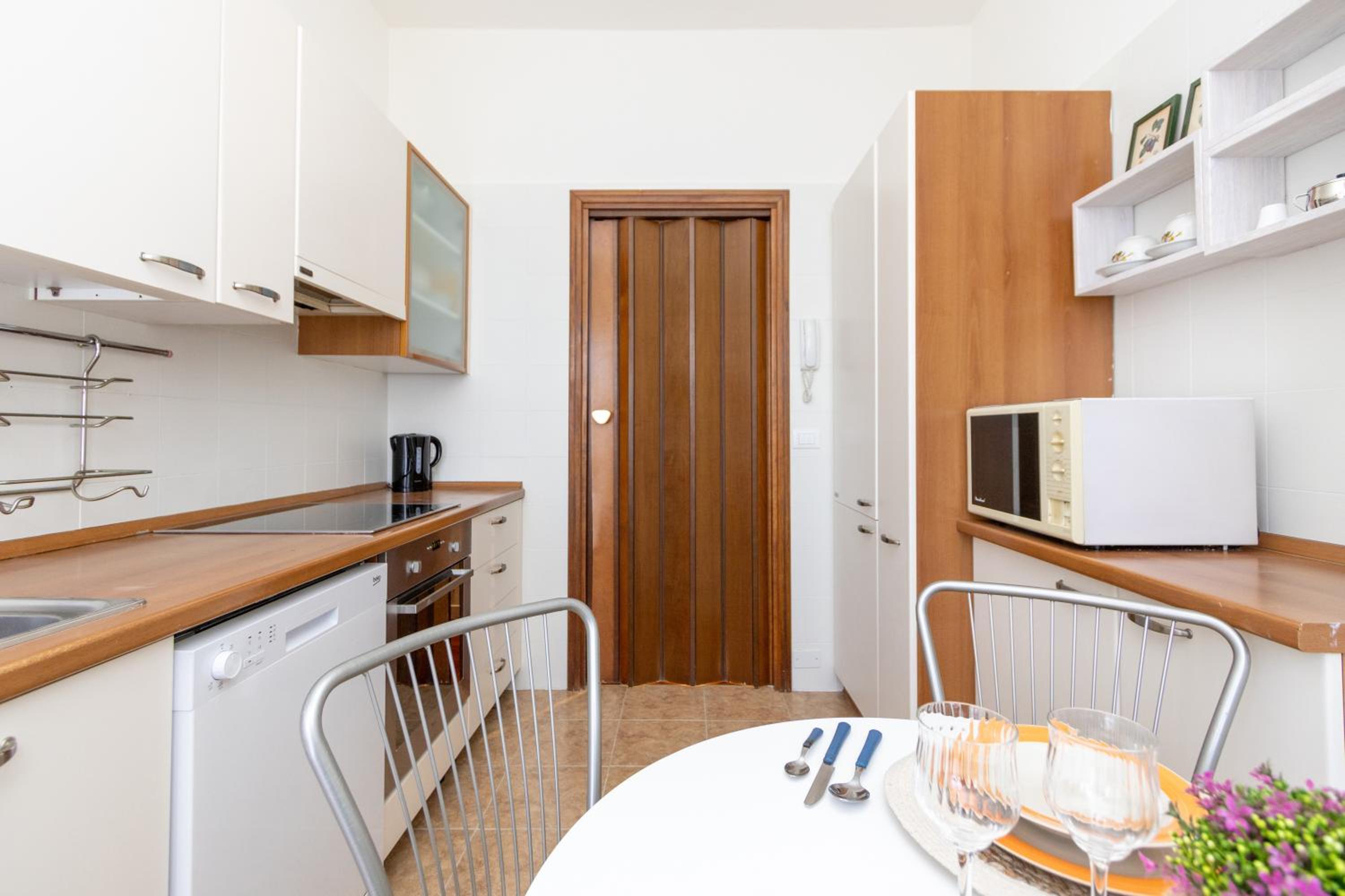 Modern suite with balcony and park view