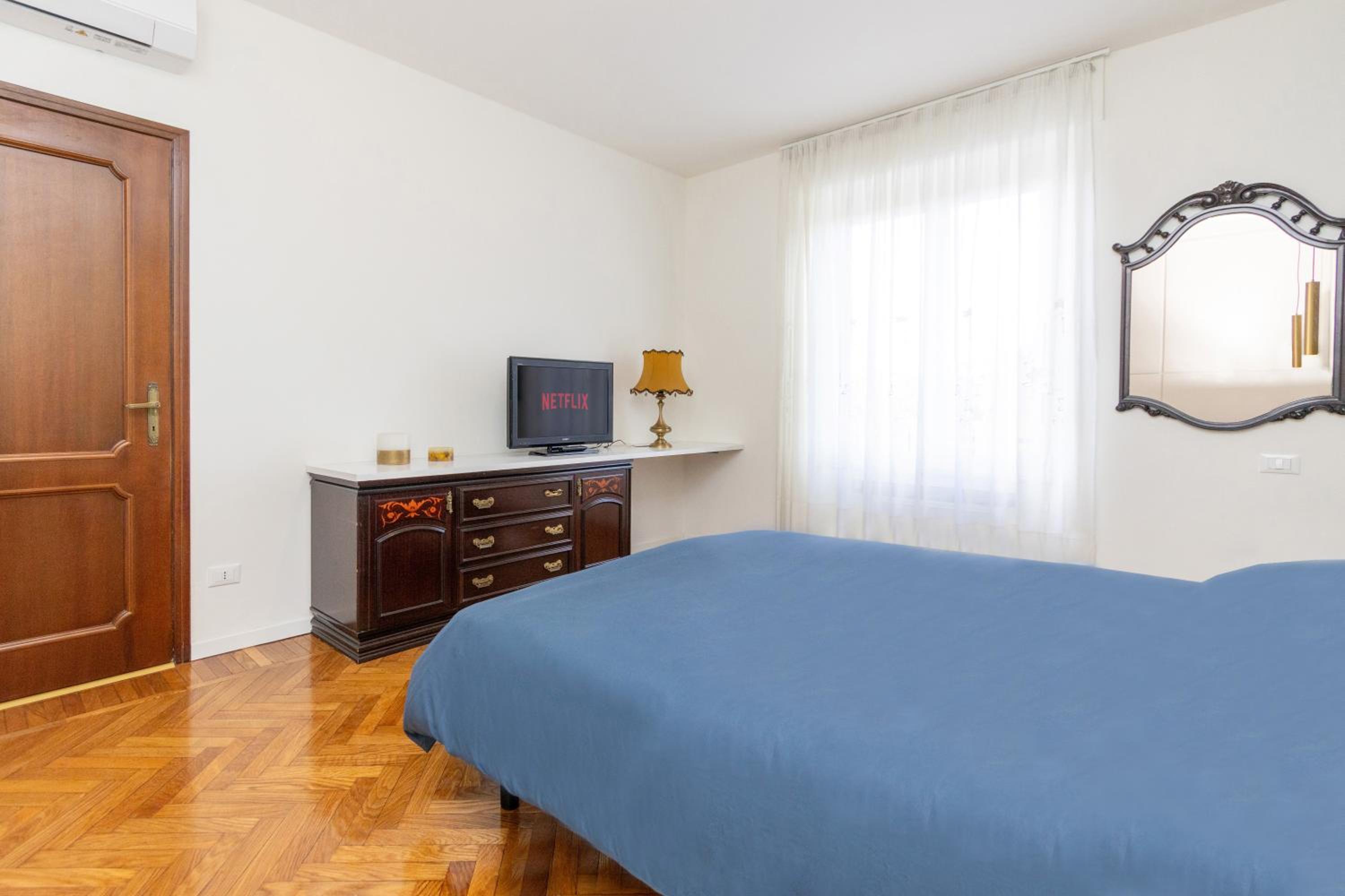 Modern suite with balcony and park view