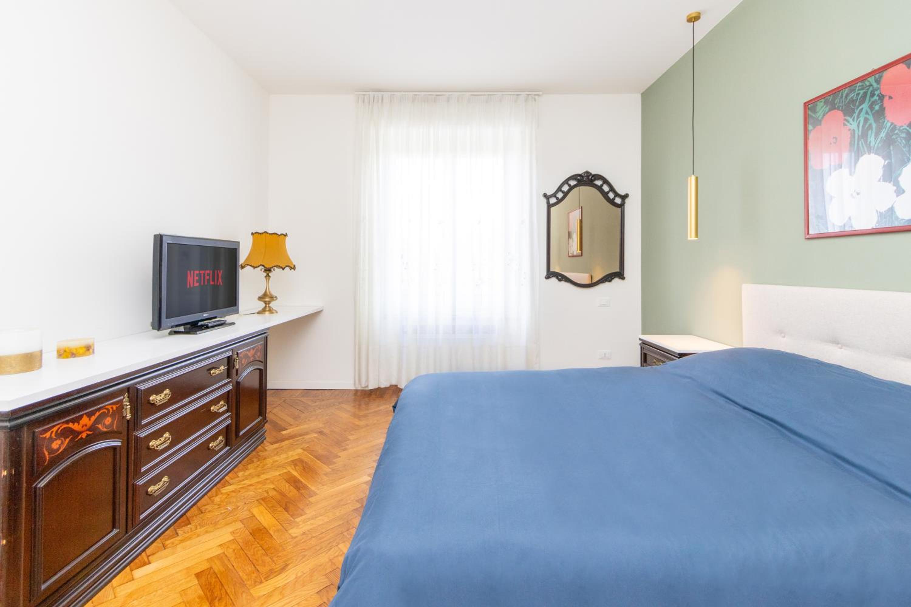 Modern suite with balcony and park view