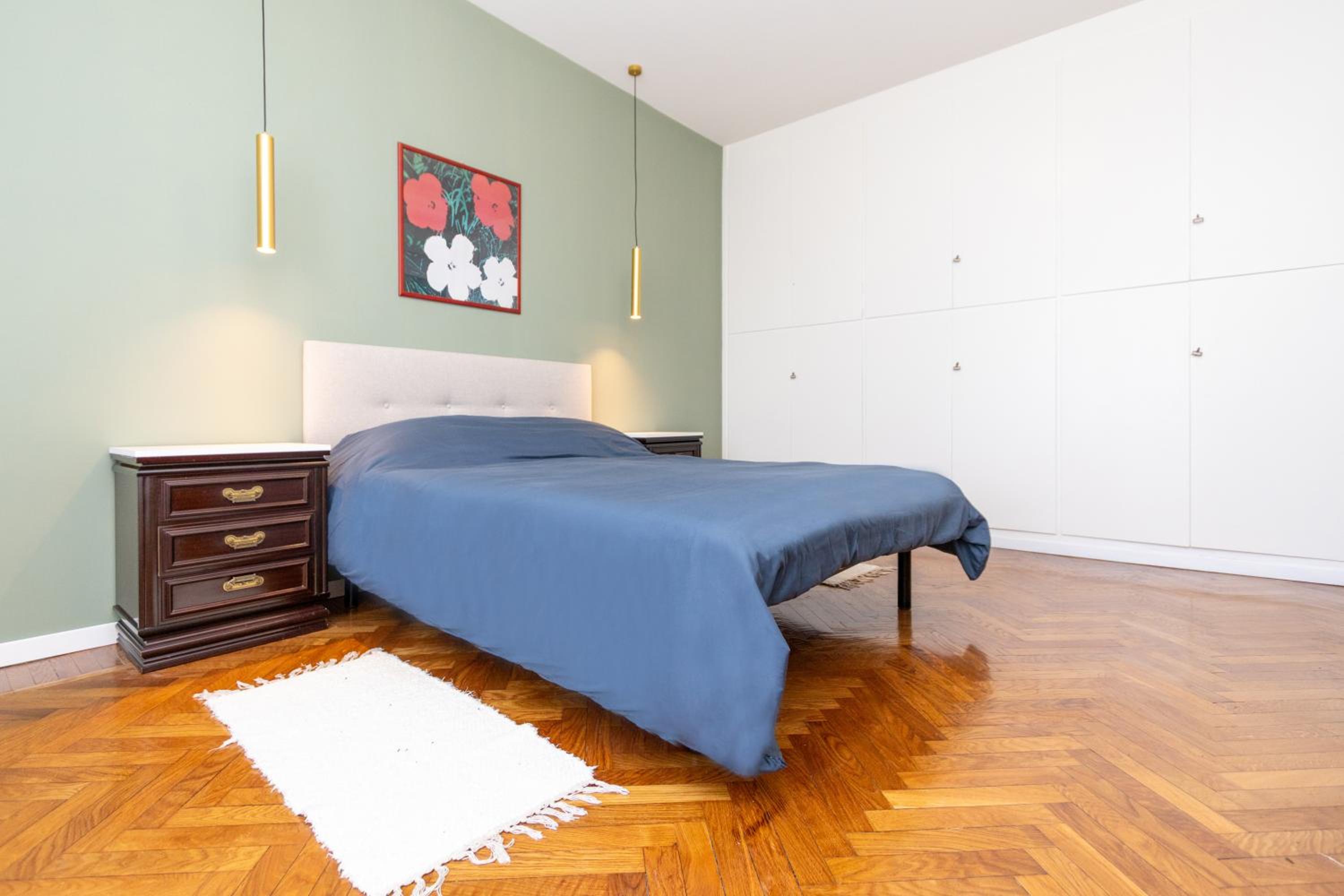 Modern suite with balcony and park view