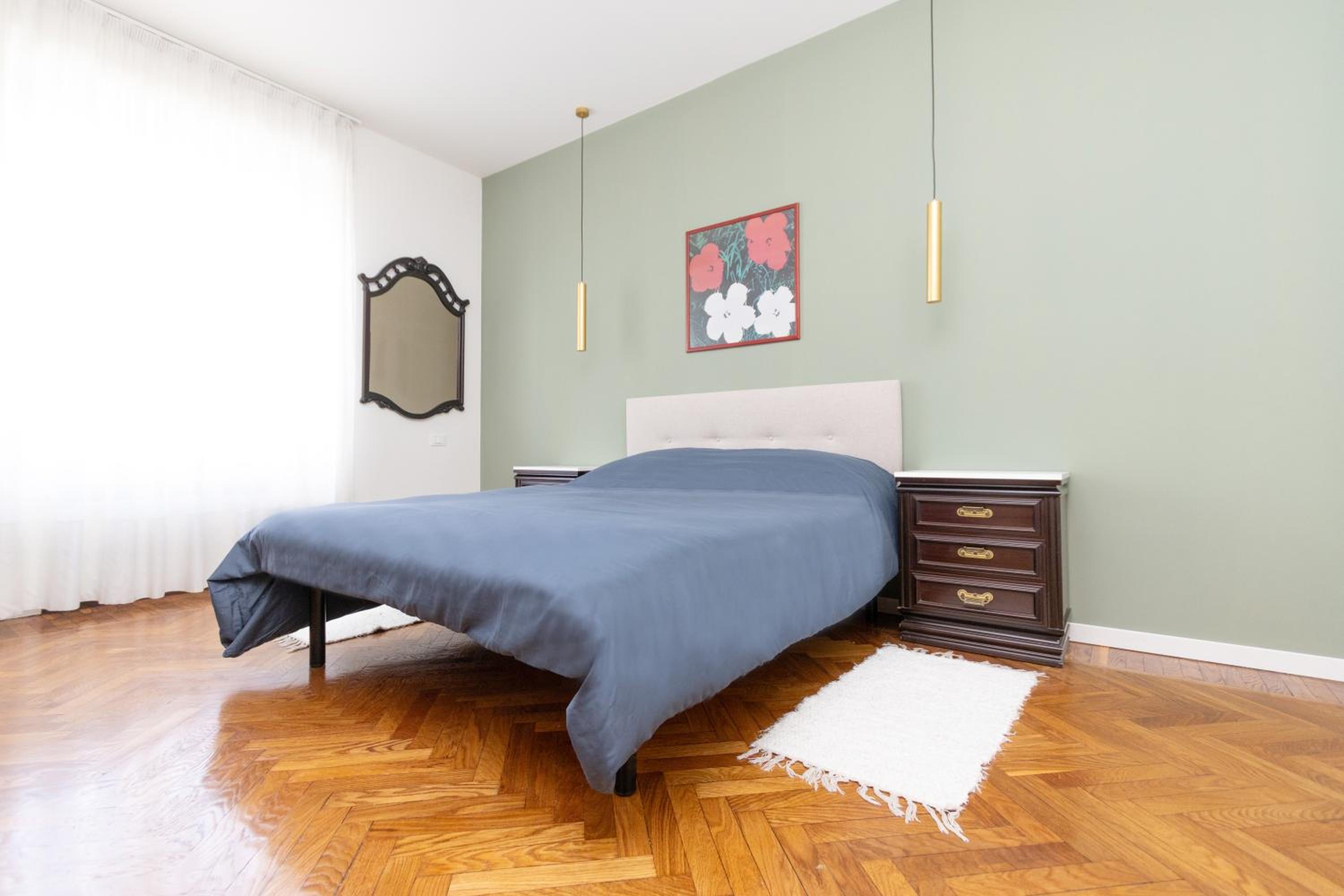 Modern suite with balcony and park view