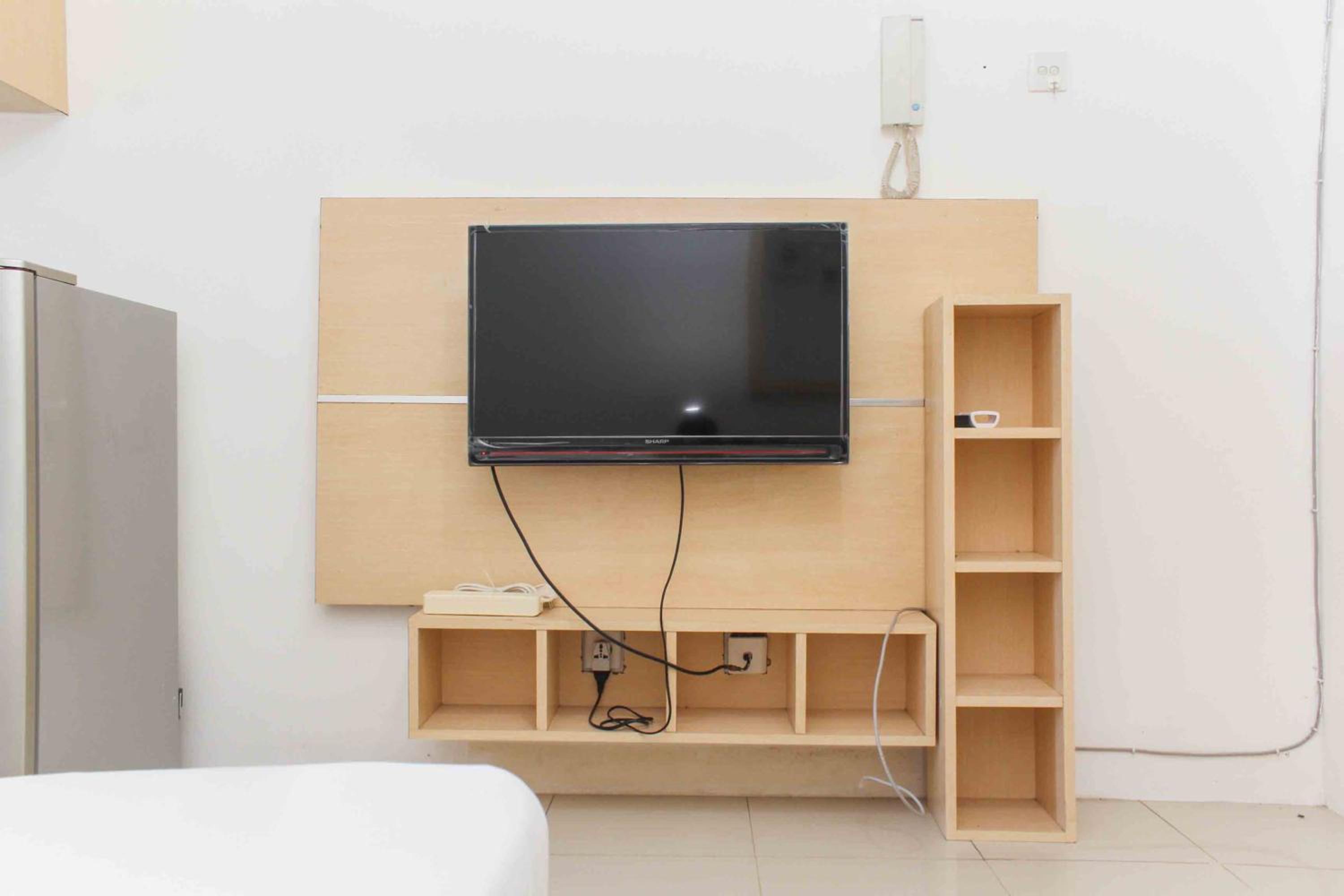 Simple and Cozy Living Studio Room at Bassura City Apartment By Travelio view 3