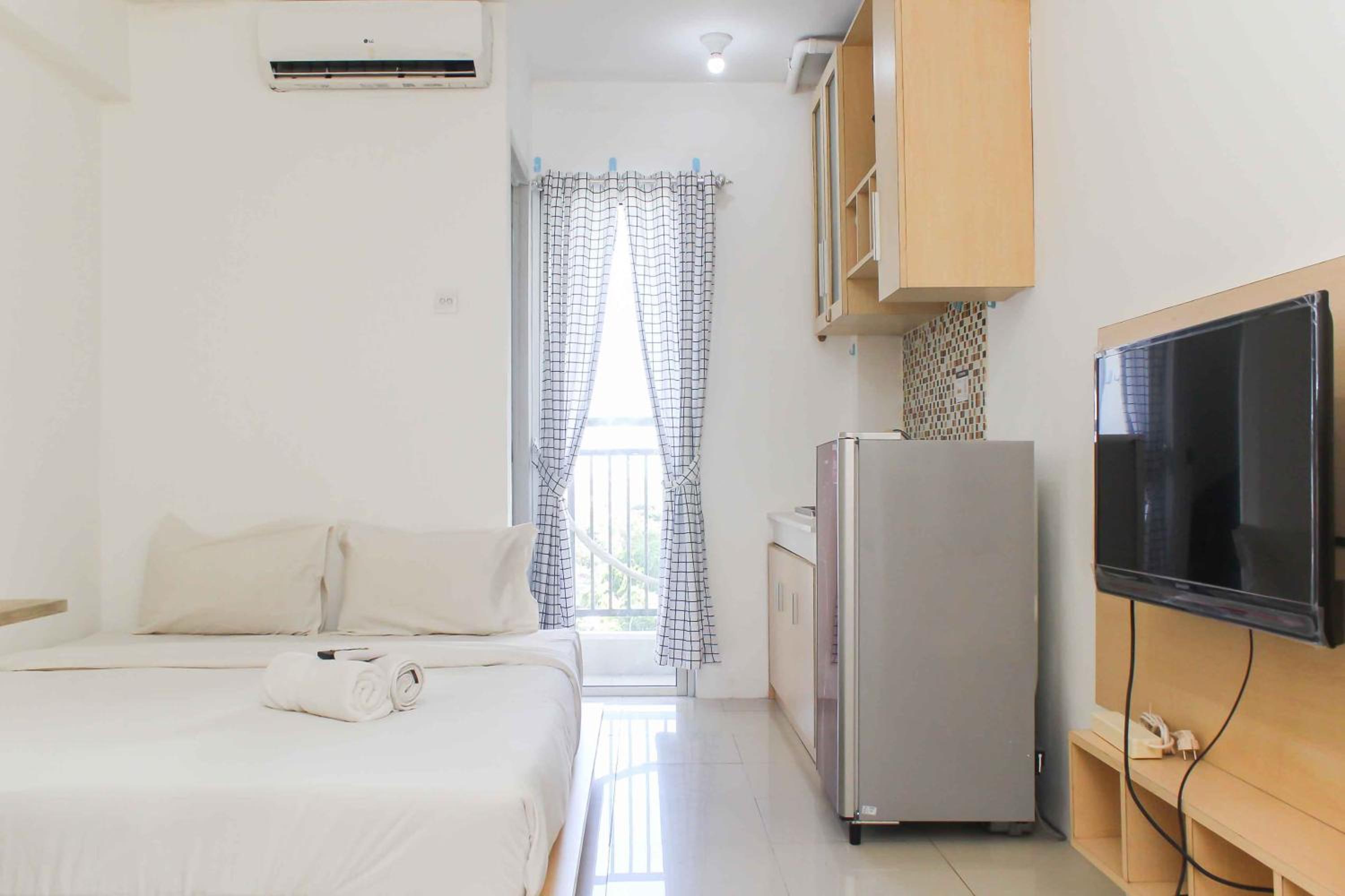 Simple and Cozy Living Studio Room at Bassura City Apartment By Travelio view 5