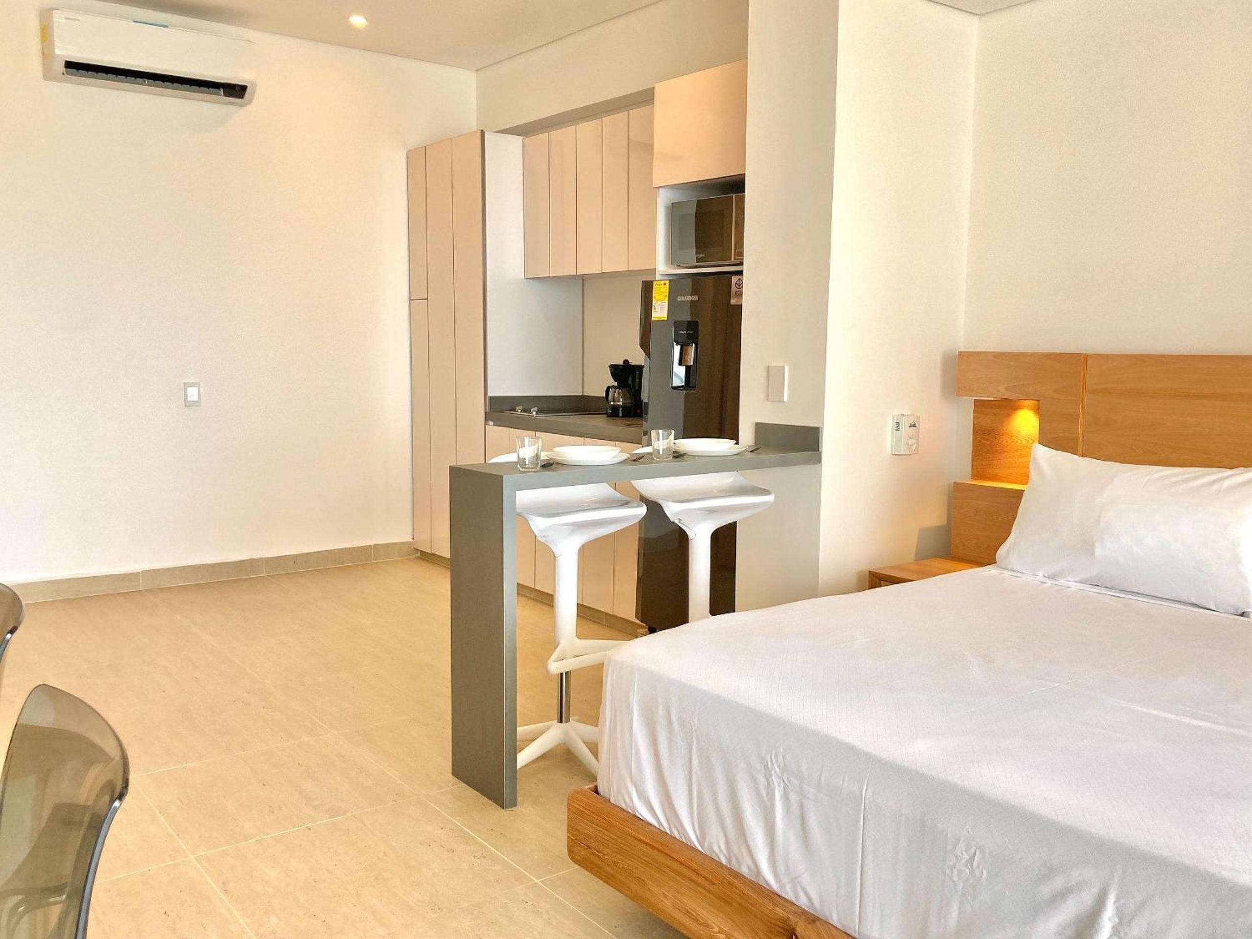 Suite vista al mar con hamaca y 2 camas queen p 12
