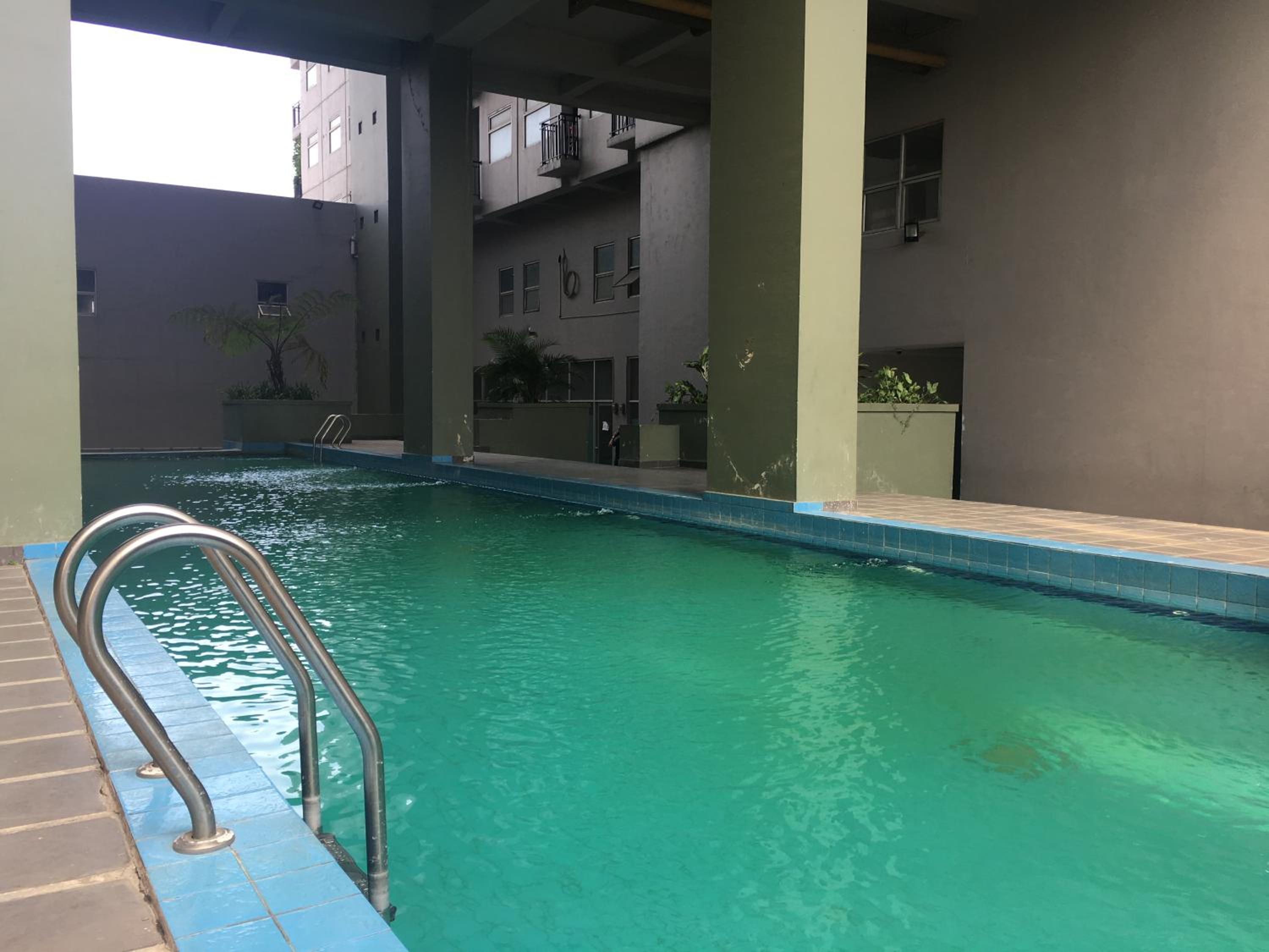 Homey Studio Furnished at Grand Asia Afrika Apartment By Travelio