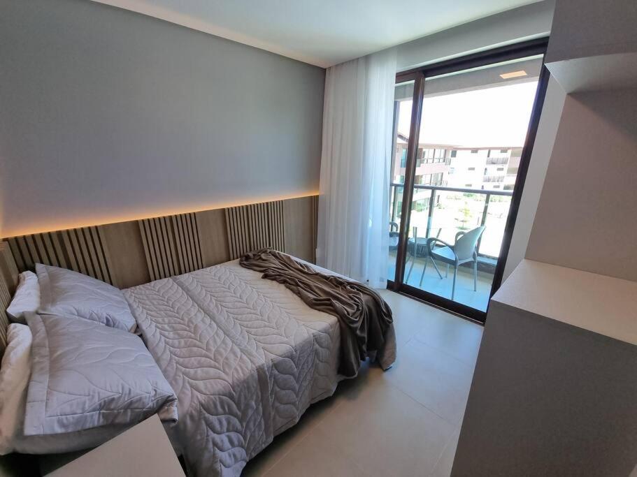 303D Apartamento dois quartos Condomínio Beira Mar