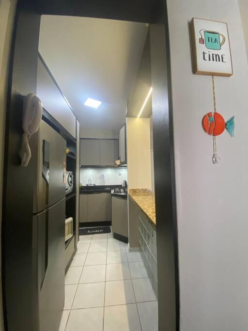 Apartamento encantador com piscina, em frente praia
