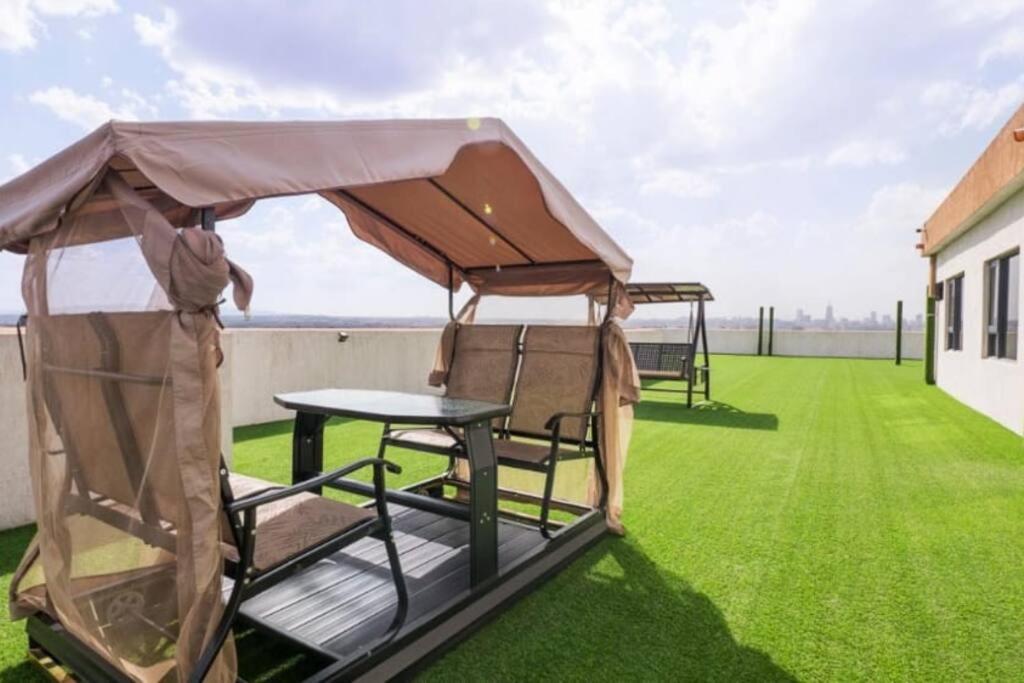 Enzi heights luxurious 2 bedroom furnished and serviced apartment with a pool,gym and playground